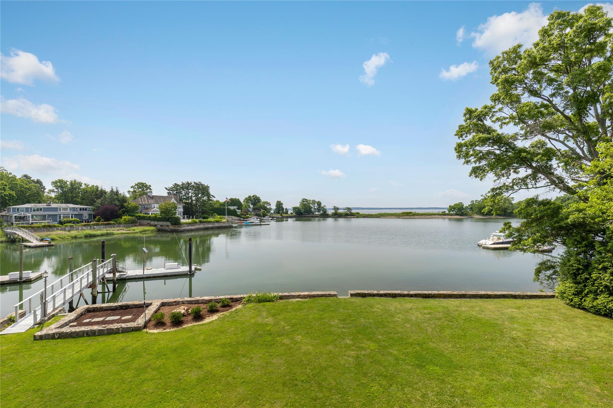 Experience iconic waterfront living in this spectacular midcentury mod...