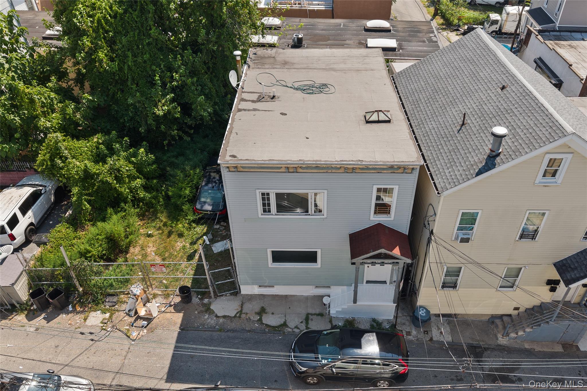 Welcome to this FULLY RENOVATED two-family home! This property boasts...