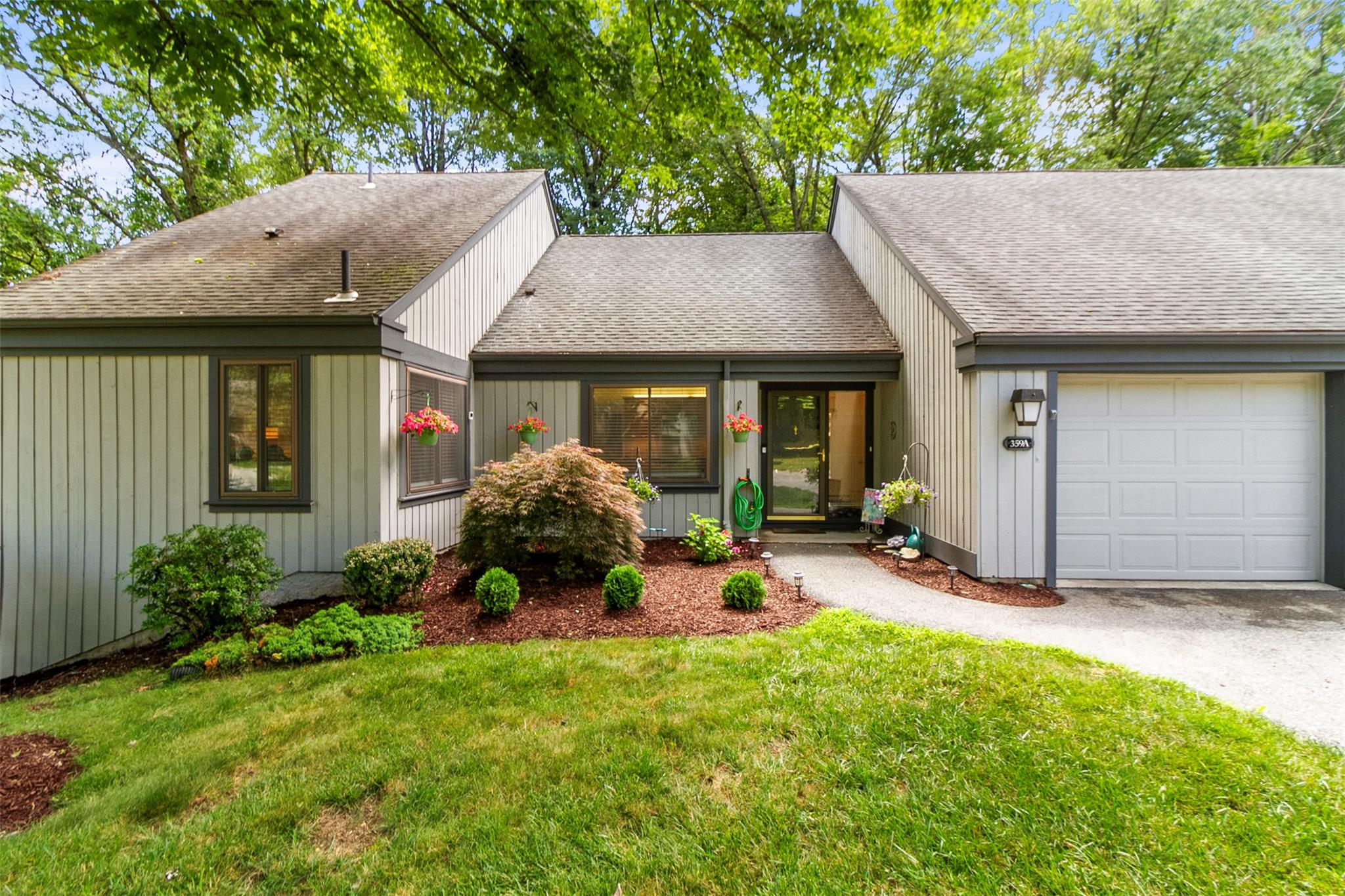Beautifully renovated condo with TWO decks in secluded setting backing...