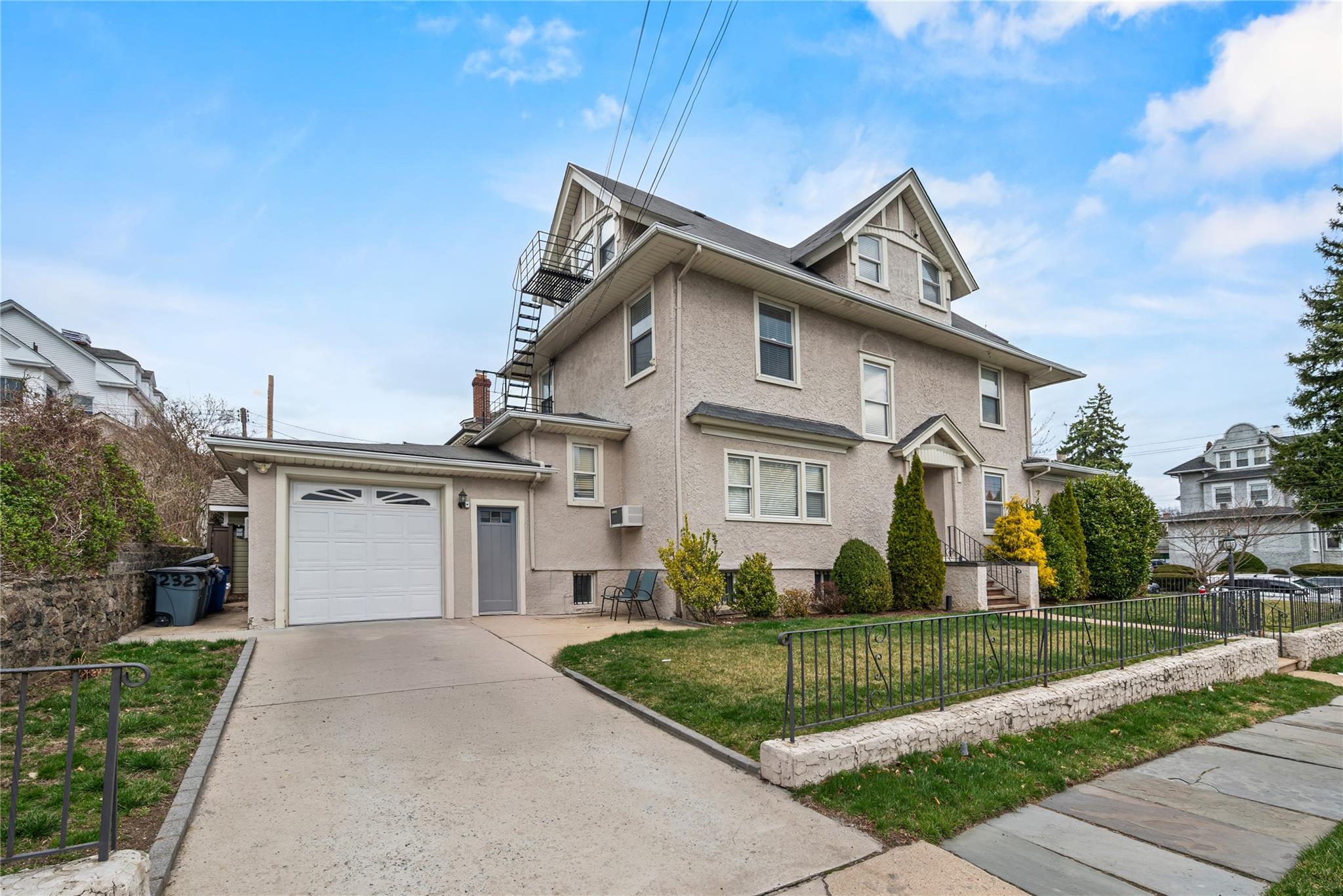 This beautifully maintained and updated three-family home has charm, c...