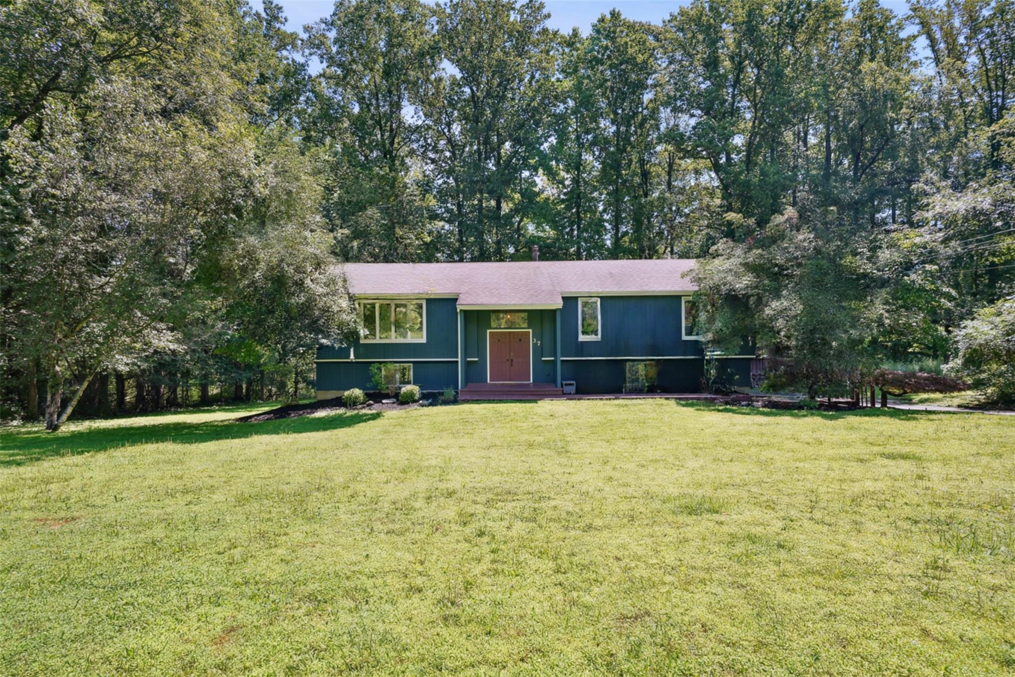 Nestled on a peaceful street in sought-after Cortlandt Manor, this bea...