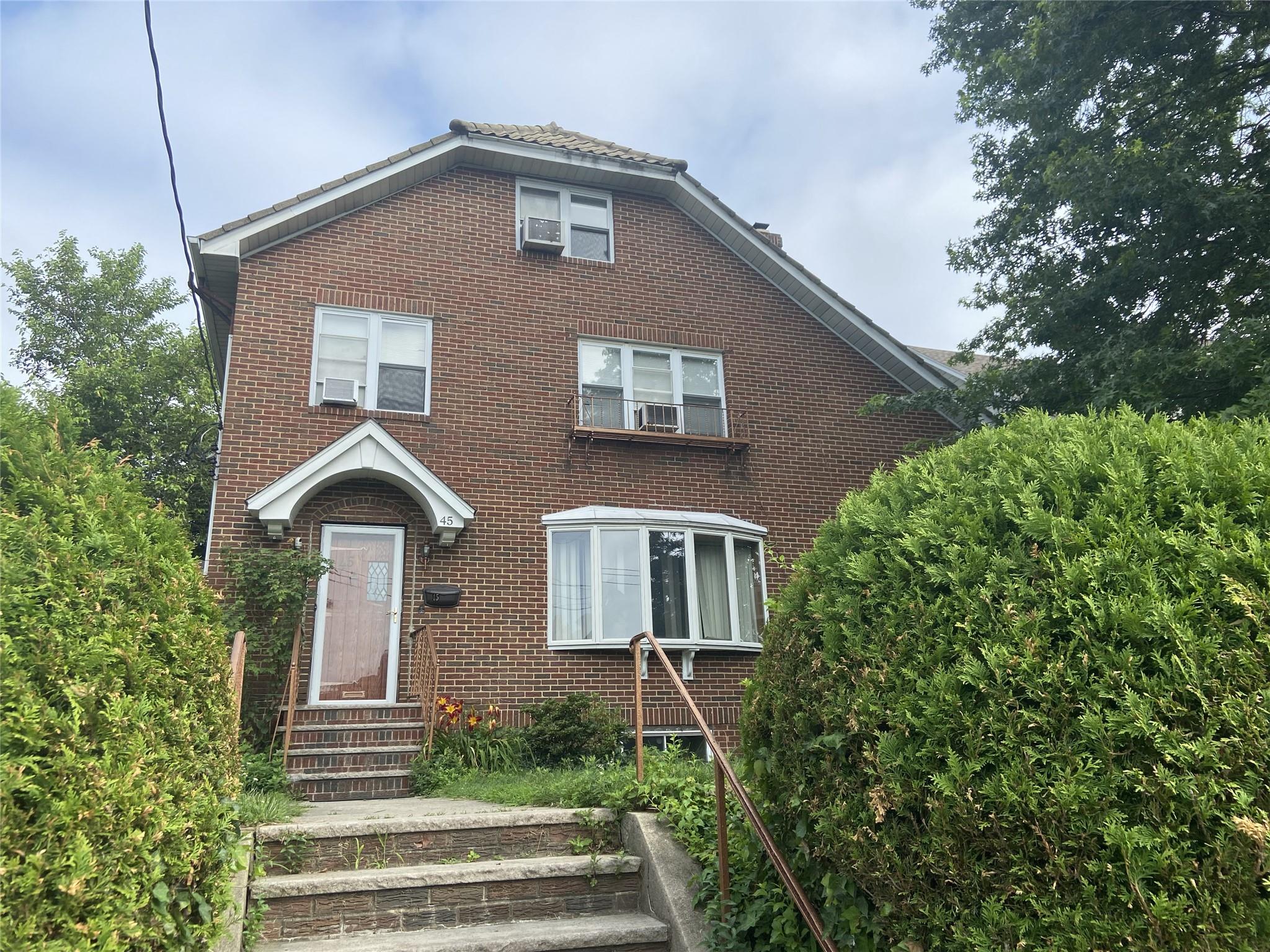 Brick Tudor home in tree-lined residential area of New Rochelle conven...