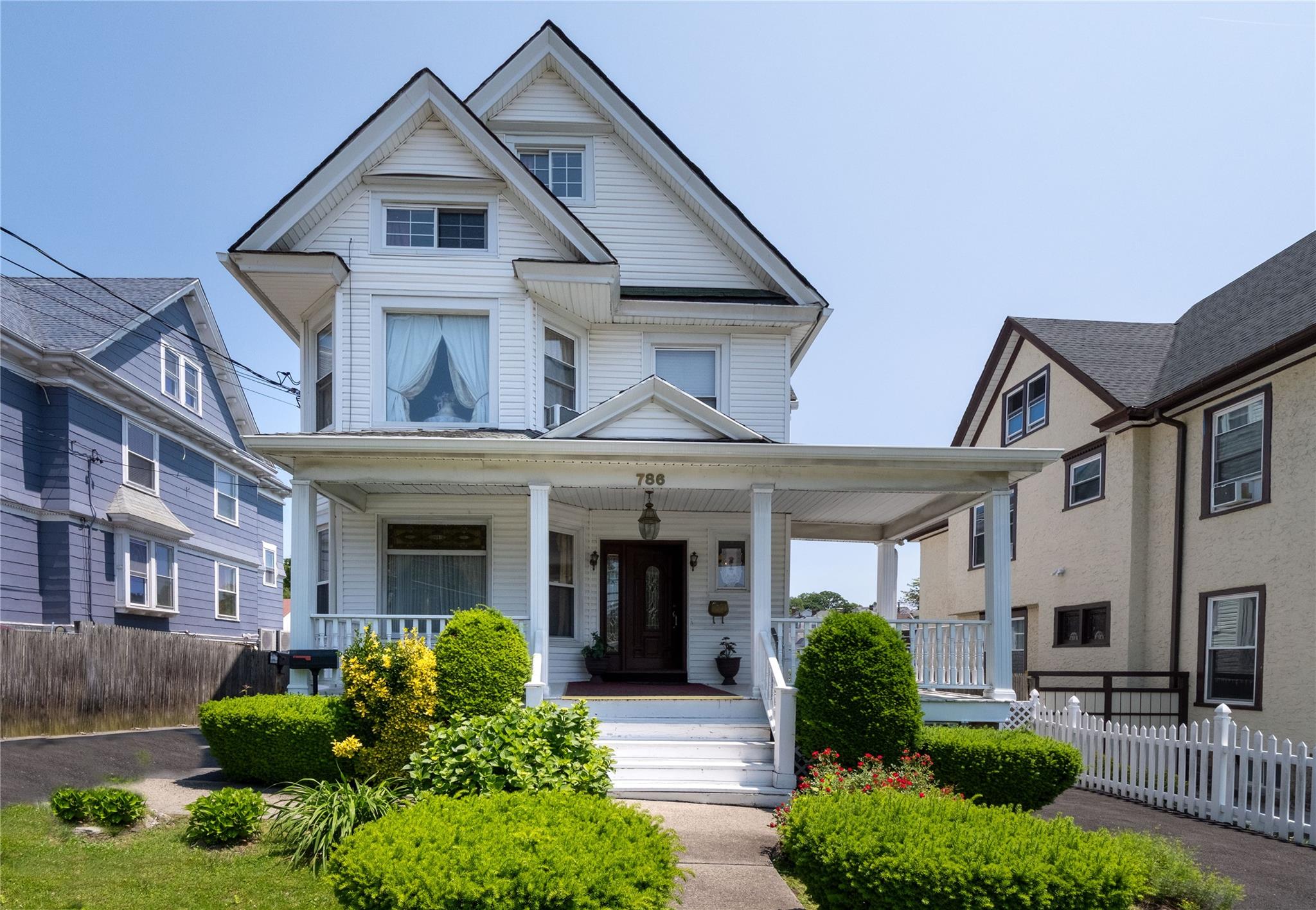 Step into the timeless charm of this 1917 Victorian home through a wel...