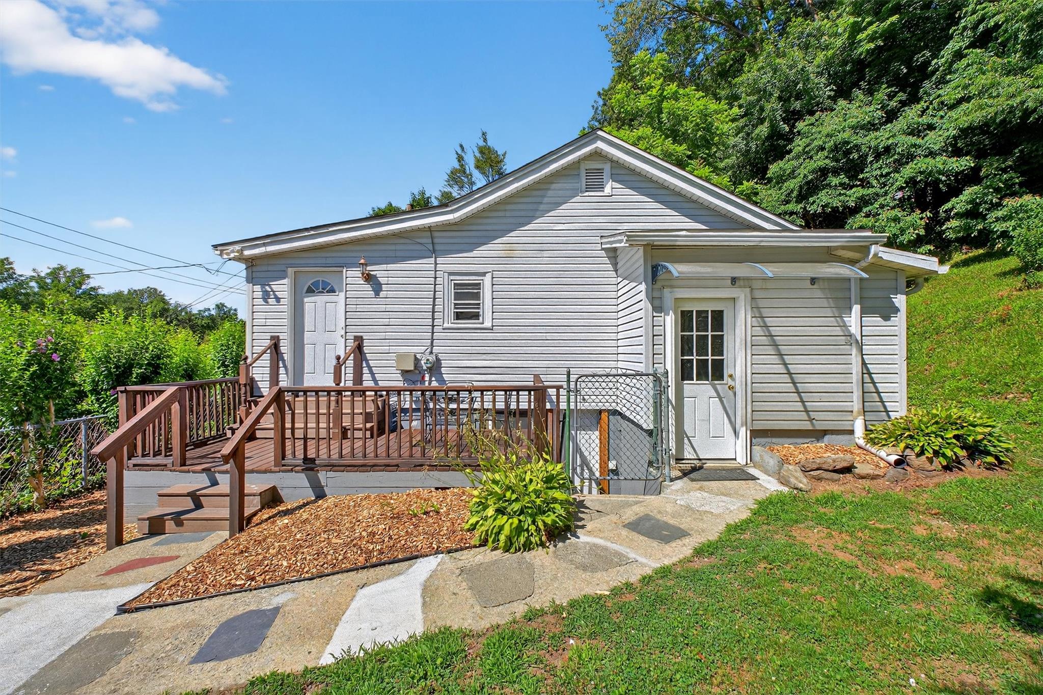 Perched atop a quiet hill, this inviting 2-bedroom, 1-bath ranch is th...