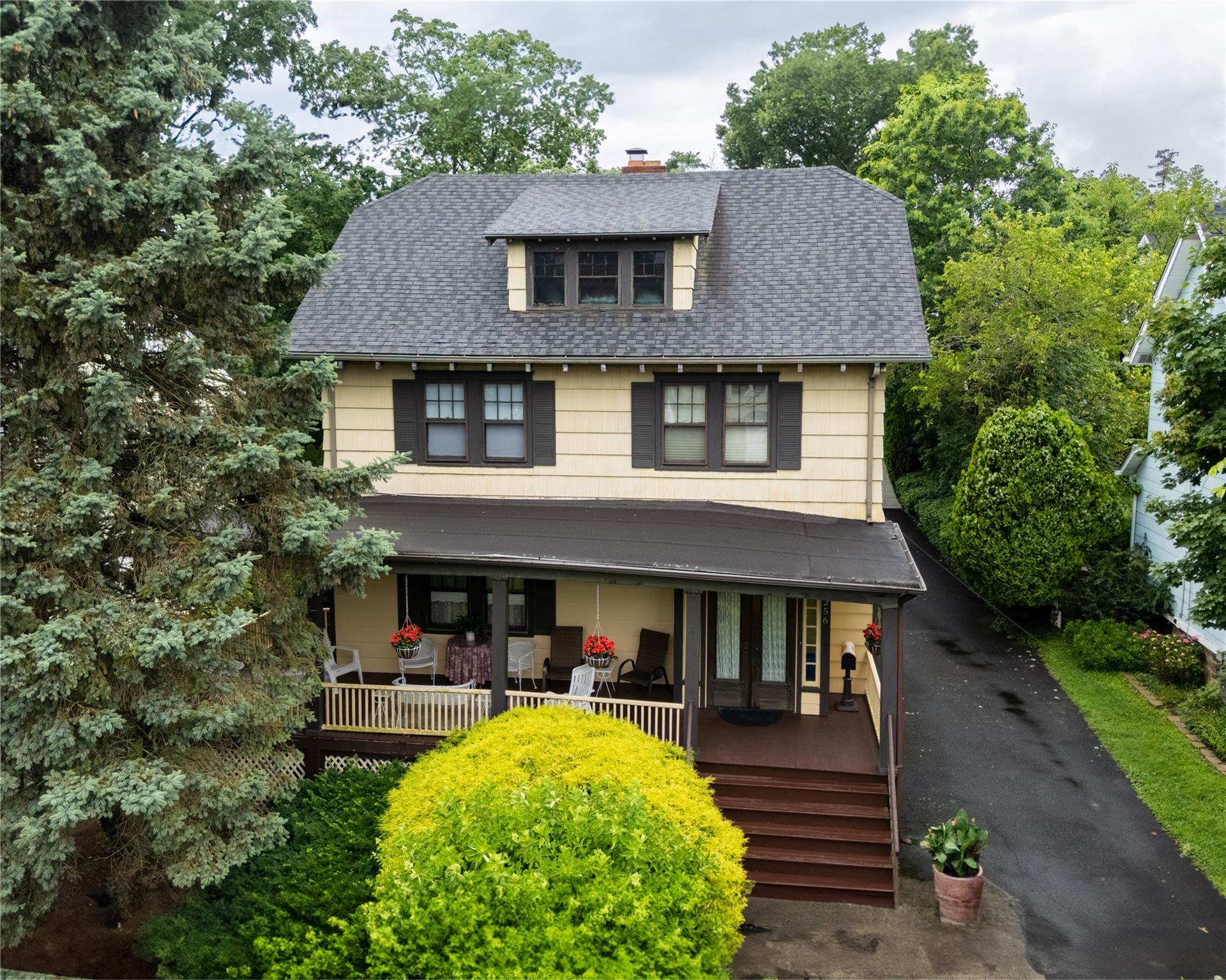 Colonial with open front porch for lazy afternoons and warm summer eve...