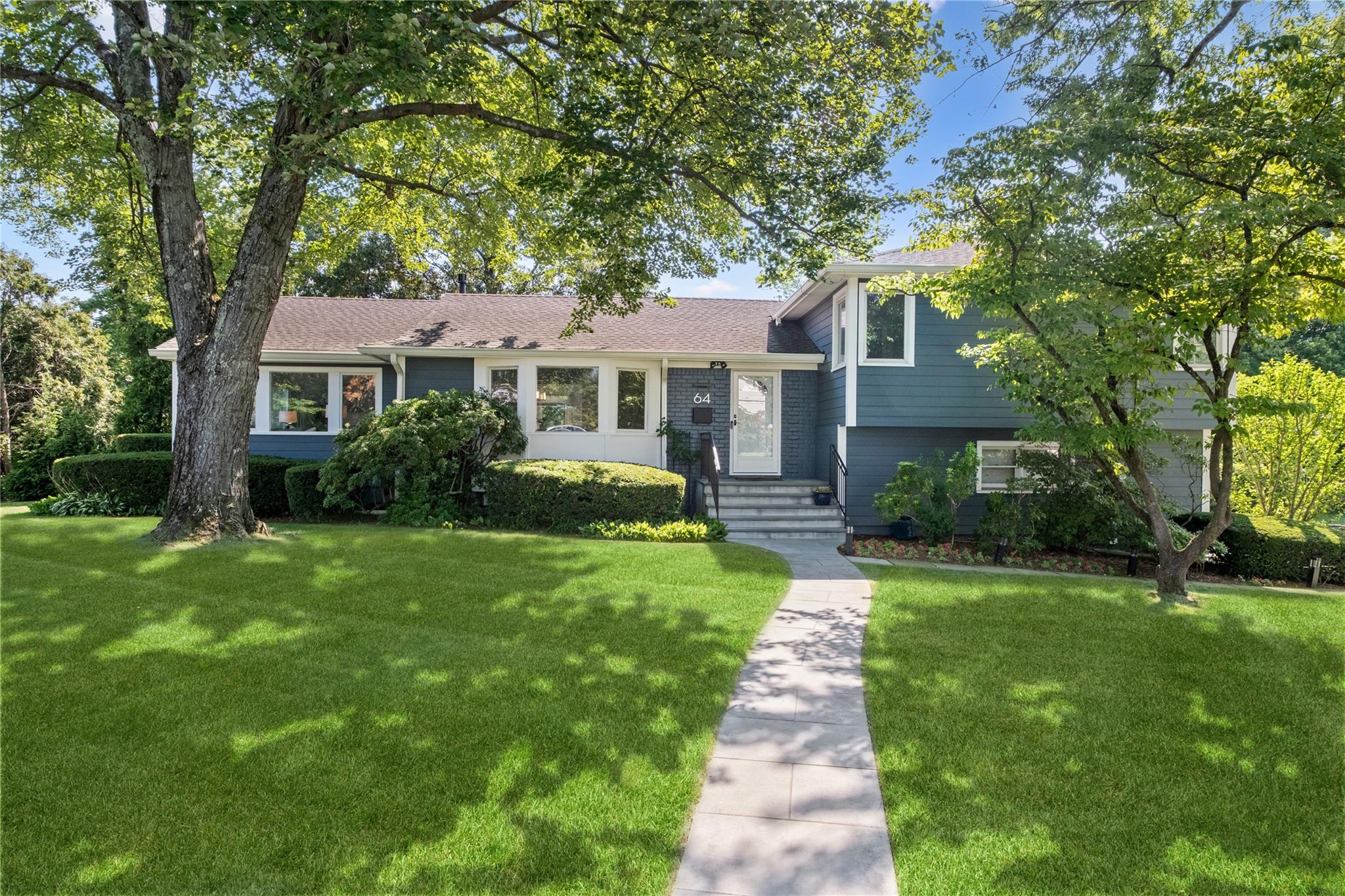 Open the front door to this striking home and sing, "Let the sun shine...