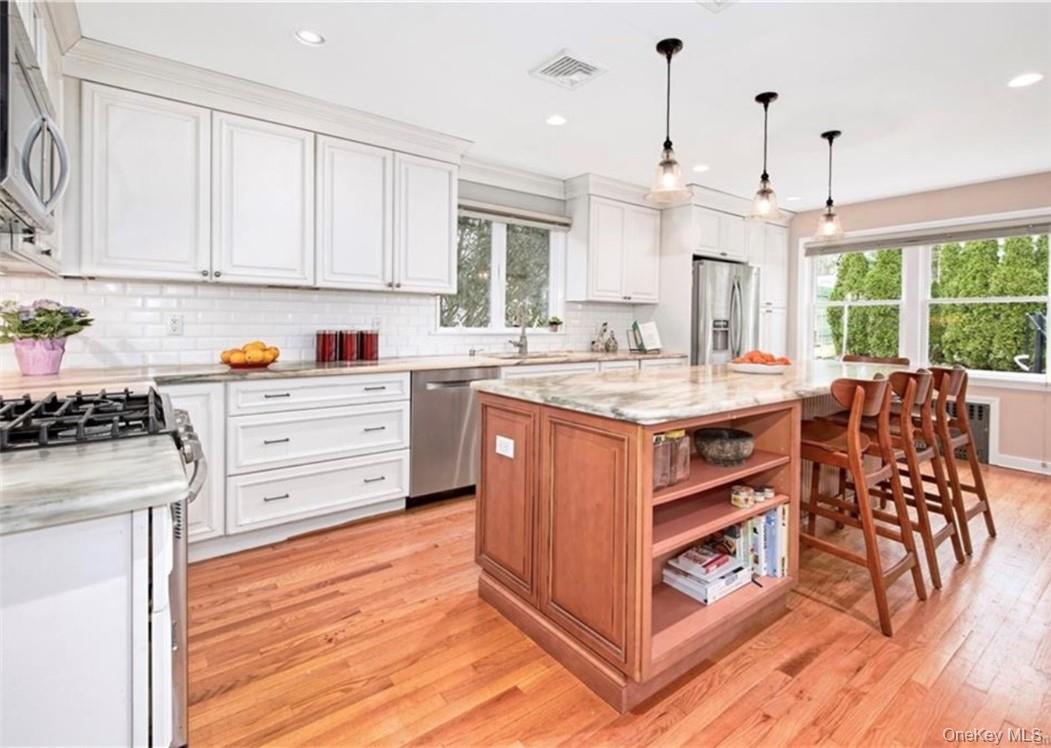 This delightful home is situated on a tranquil, tree-lined street in t...