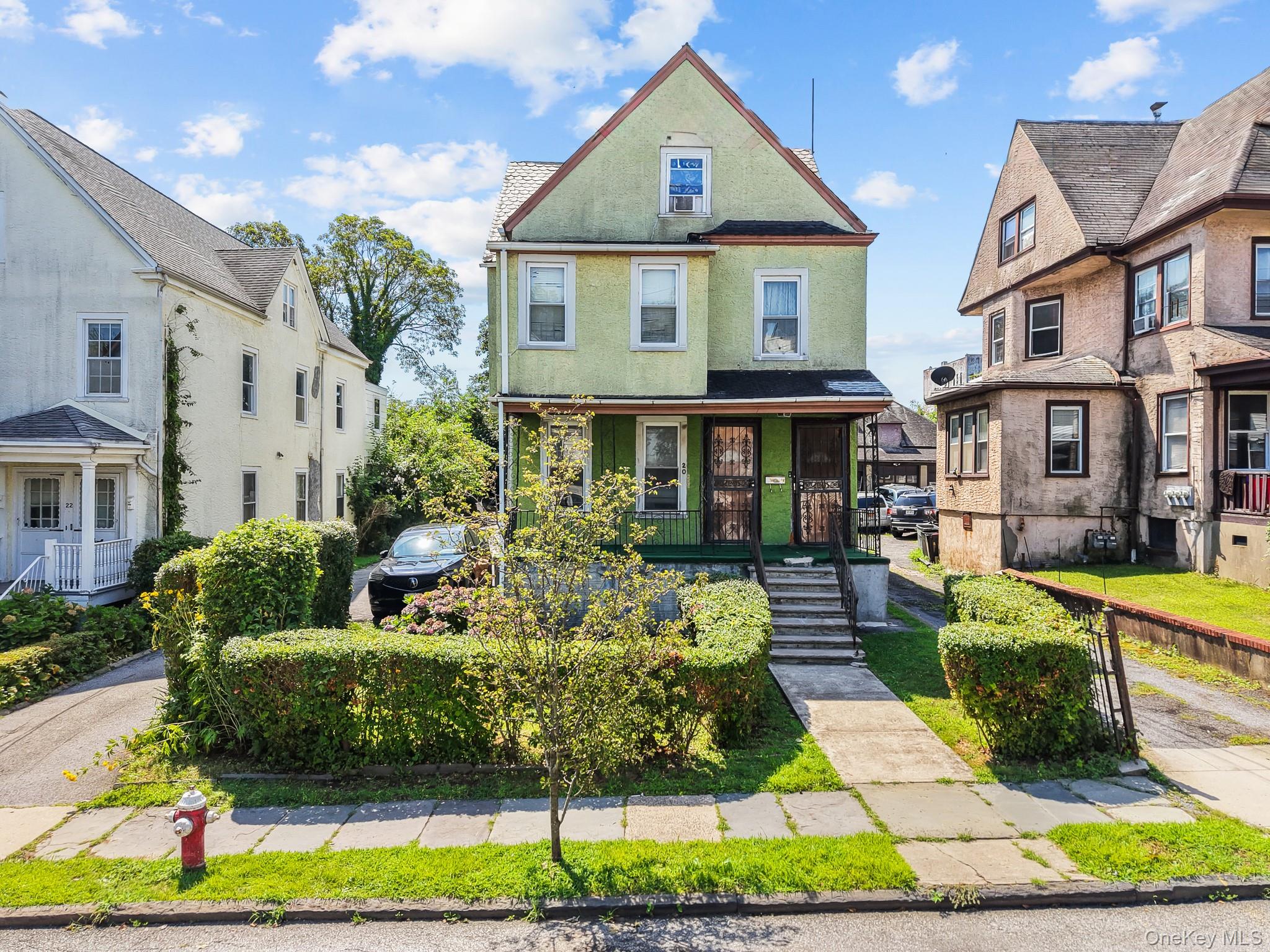 Welcome to 20 Adams Street, a detached 2-family on an oversized 30 x 1...