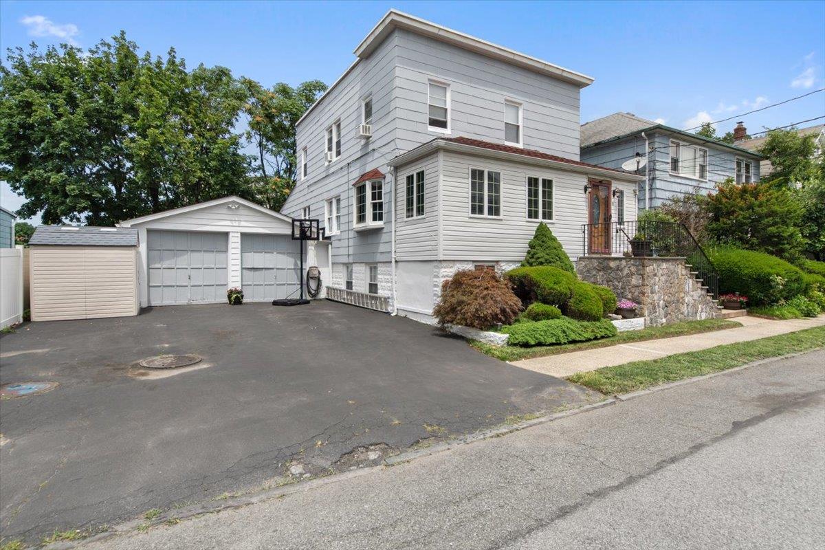 Welcome to 19 Morgan Street — a pristine, move-in-ready 2-Family home...
