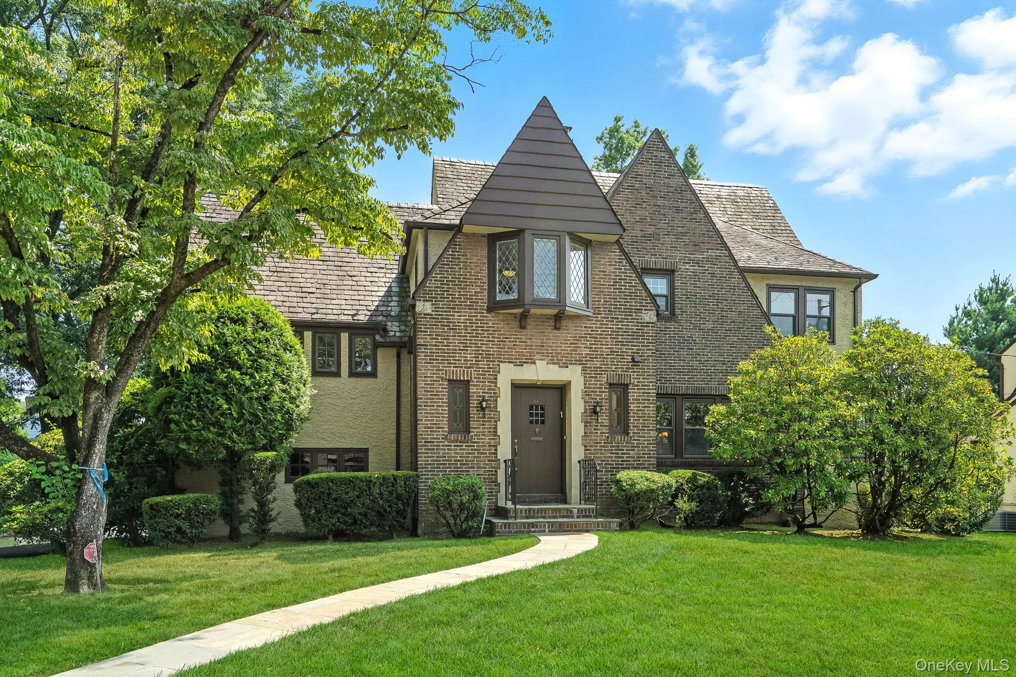 This charming Tudor blends timeless elegance with modern comfort, offe...