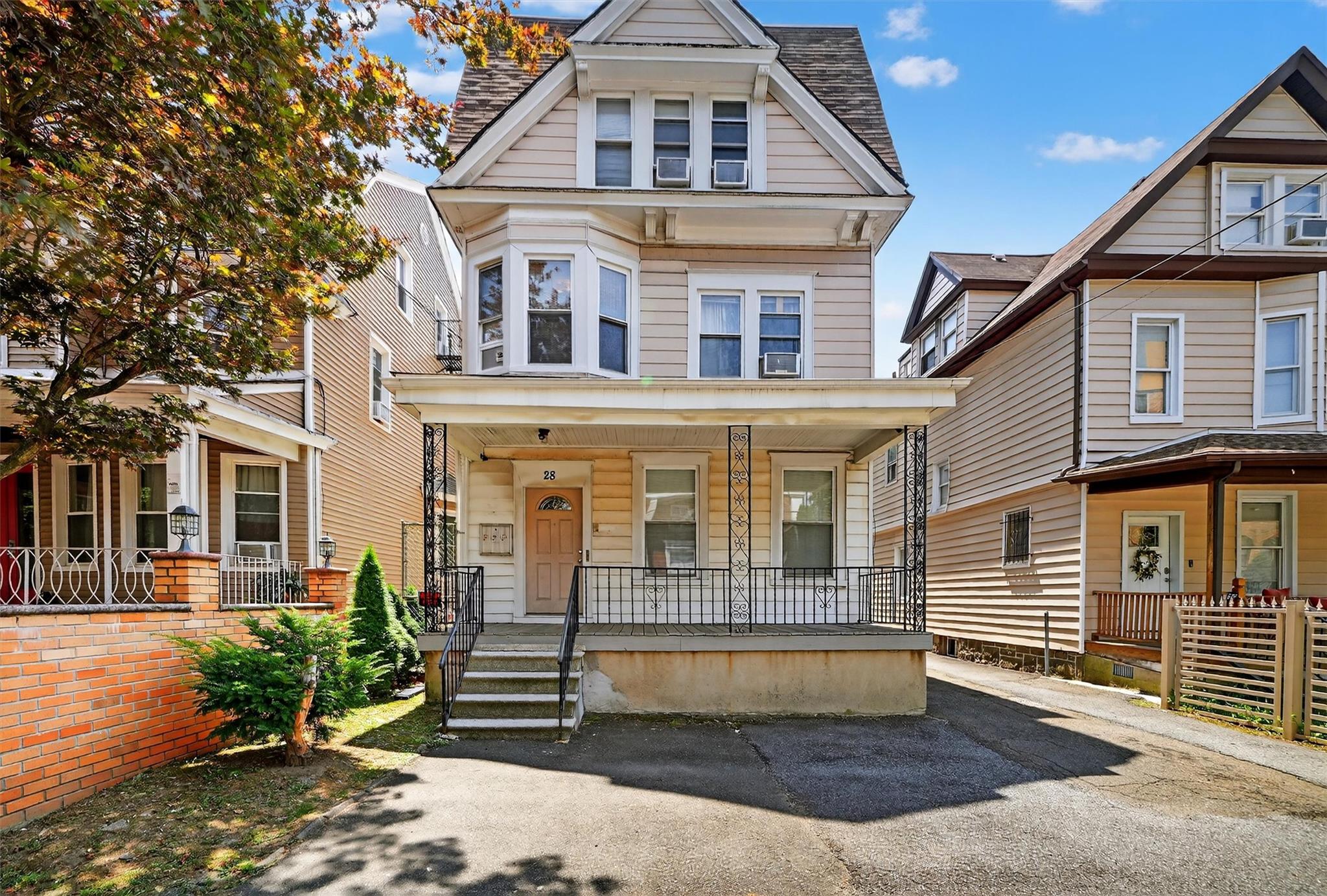 This well-maintained 2-family home features a spacious duplex apartmen...