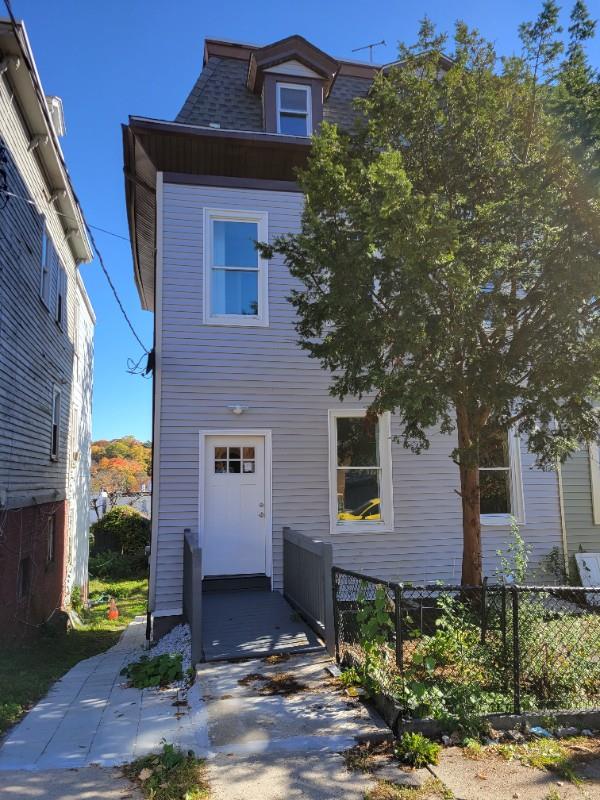 This is a well maintained 2-family house, that features a duplex apart...