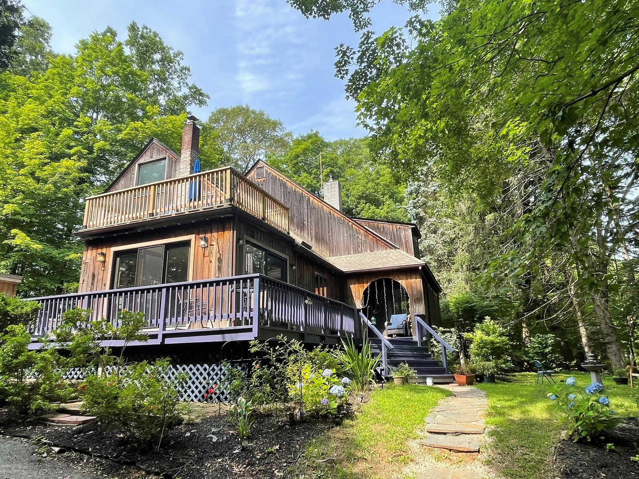 Charming chalet set on a beautifully landscaped acre plus in one of th...