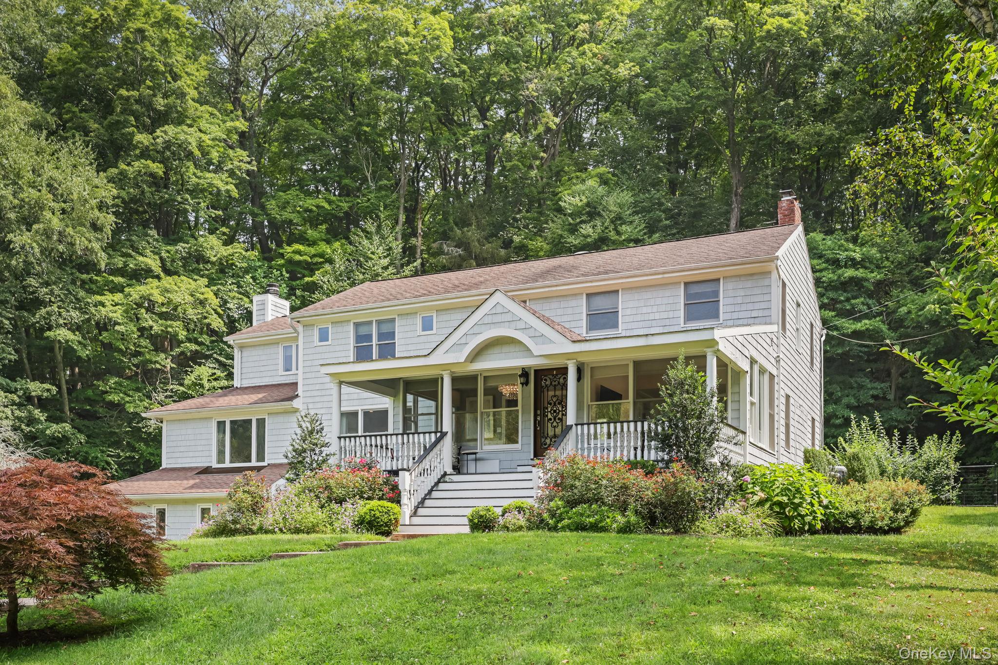 Set on over five secluded acres with picturesque pond and woodland vie...