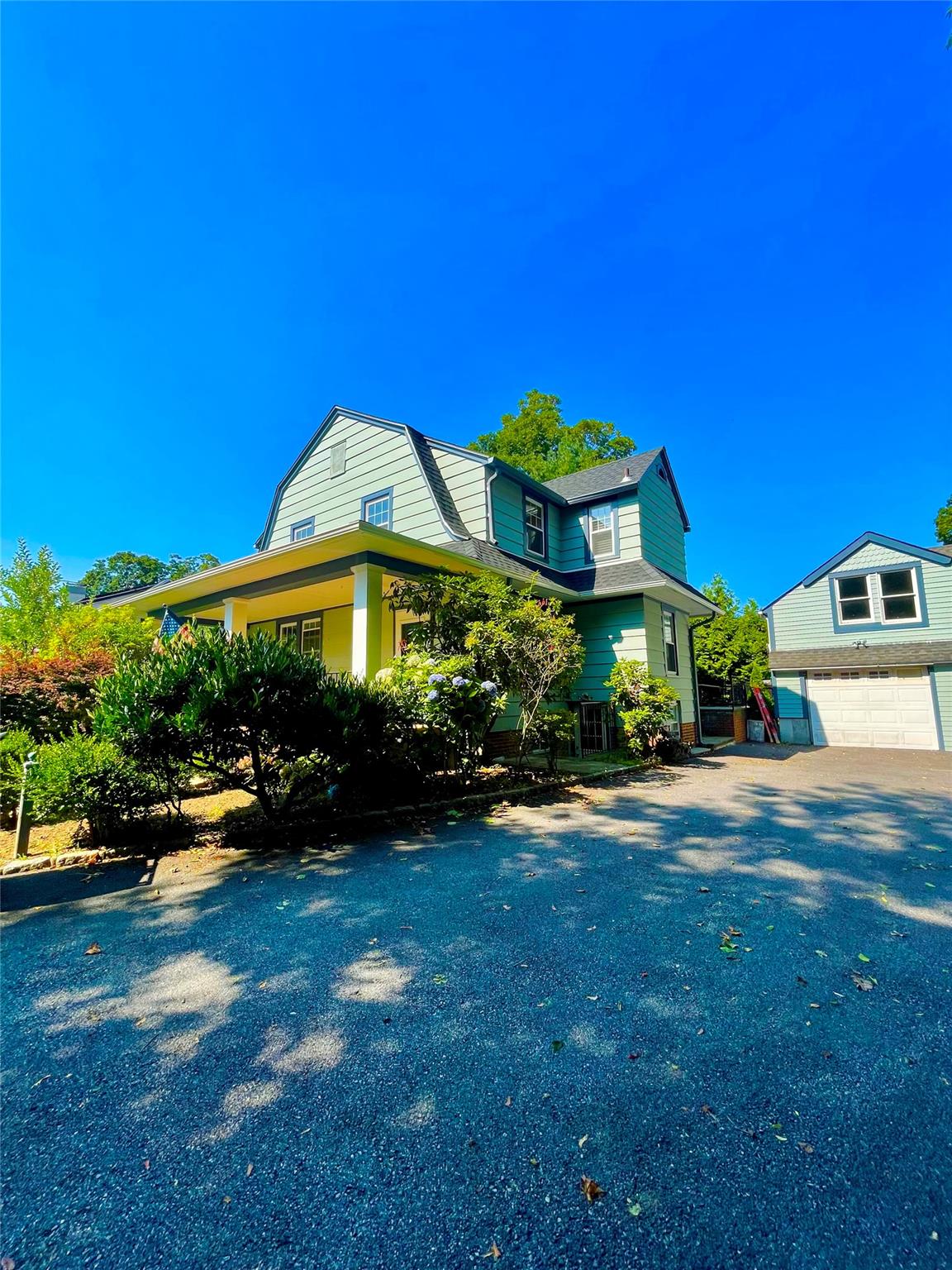 Wonderful Carriage home offers travertine stone walkway/front porch wi...
