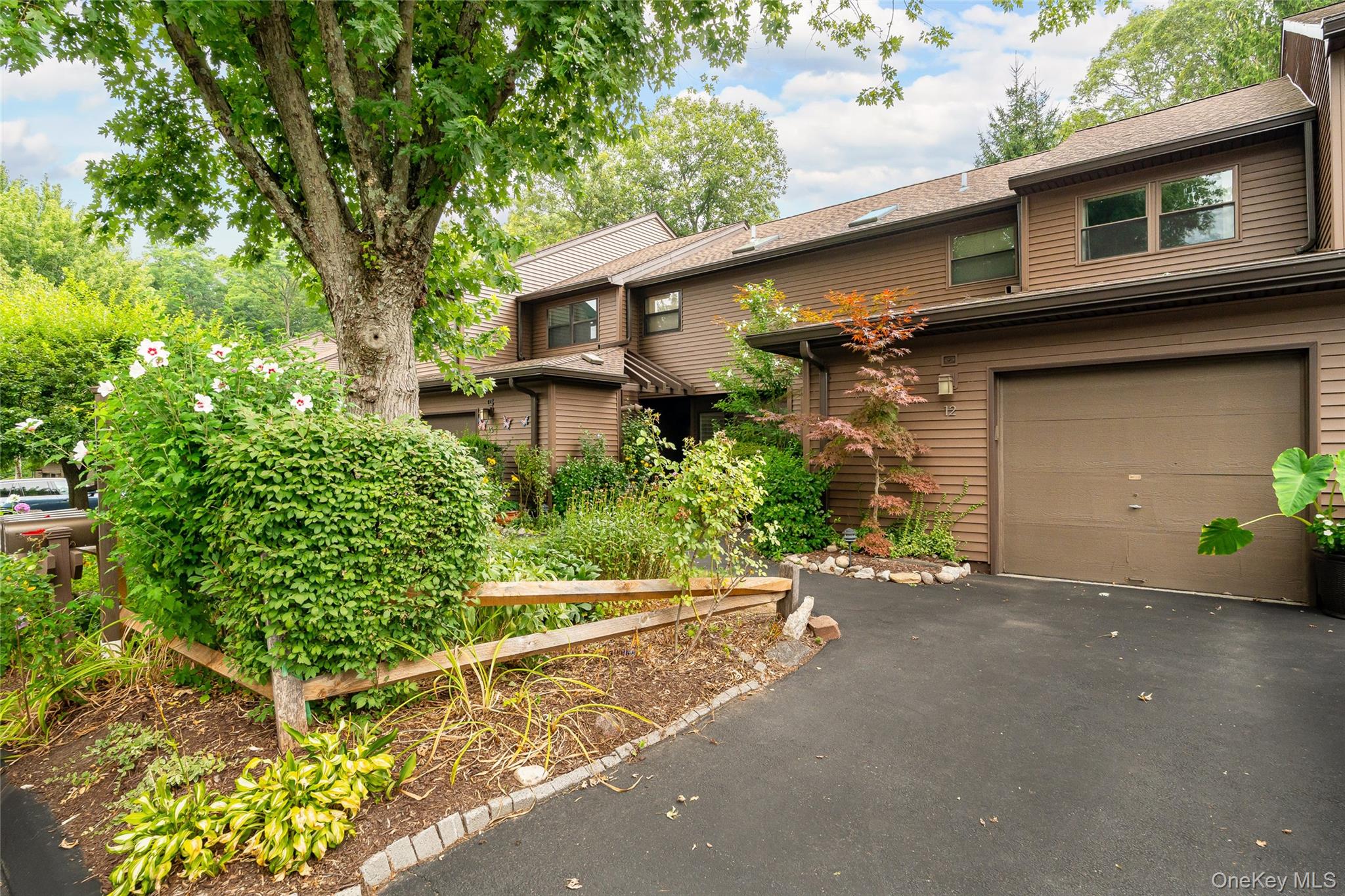 Enjoy relaxing on your private patio overlooking the spectacular garde...