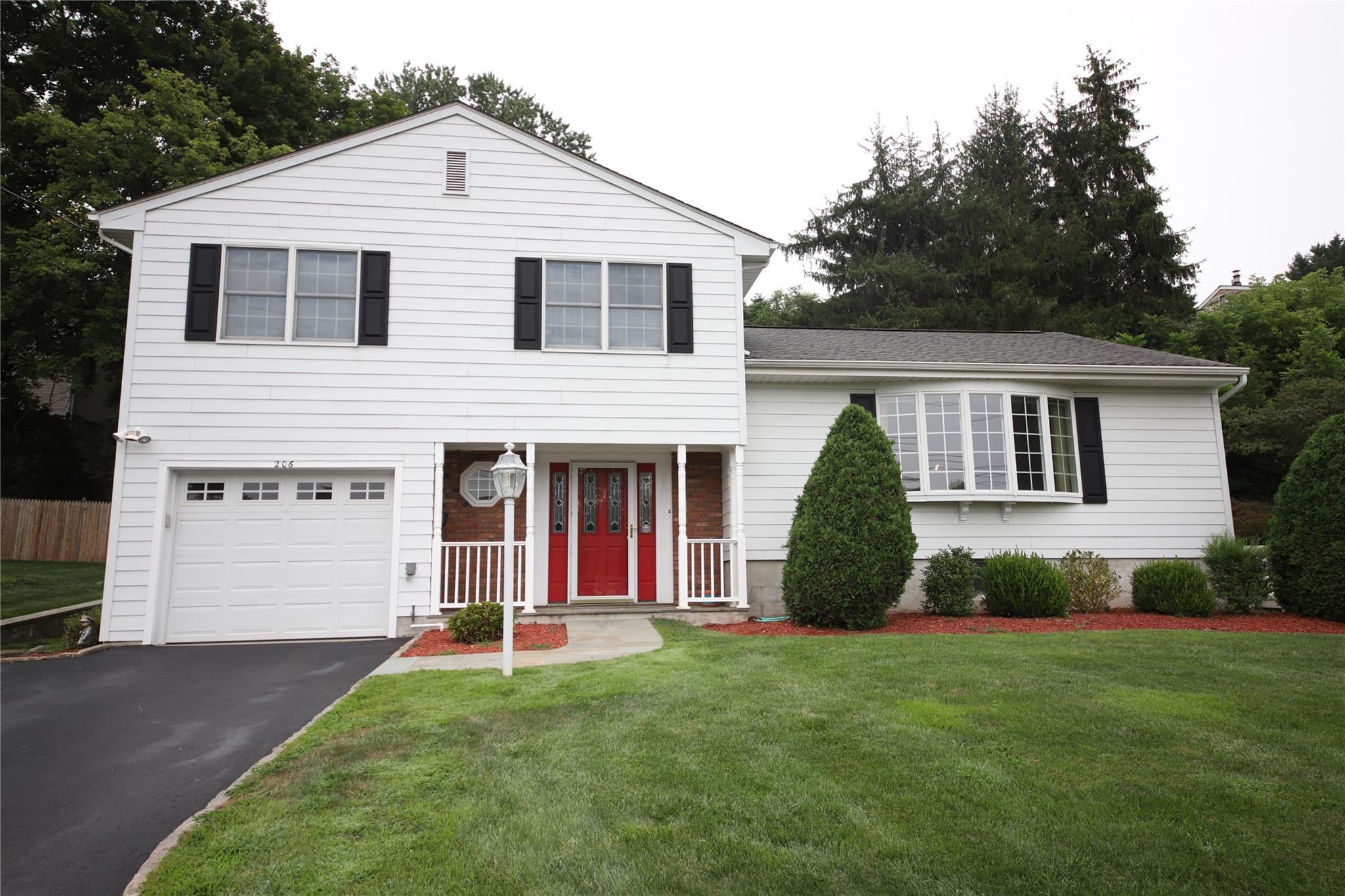 Move right into this beautiful custom split-level home, offering a per...