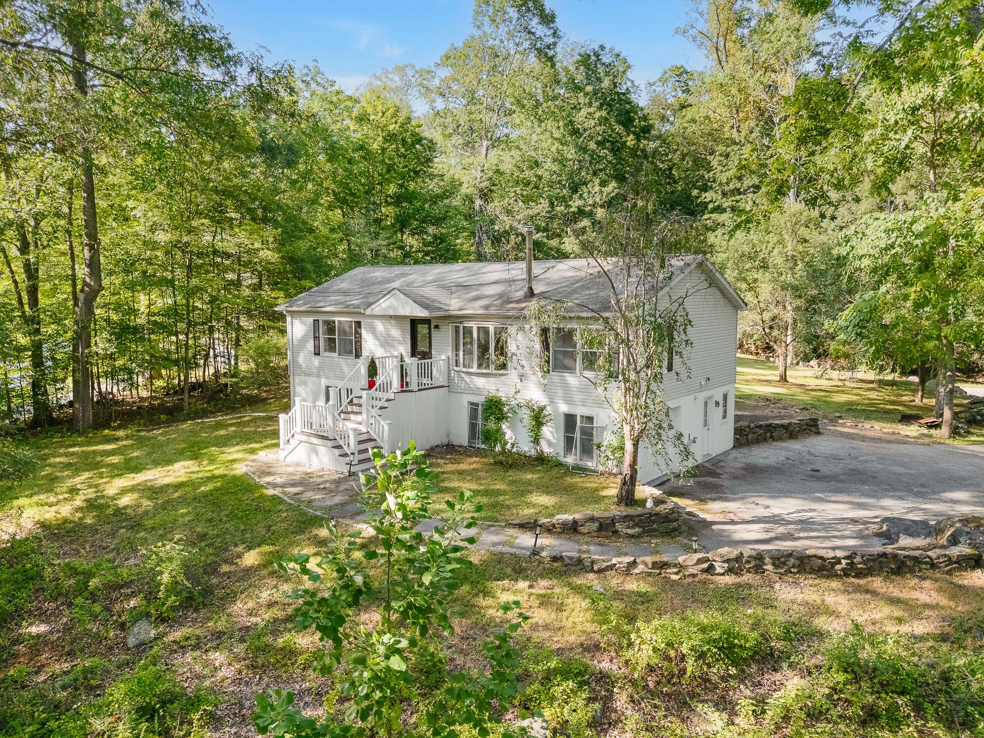 Nestled on a serene 1.81 acres of land with stunning views of Colabaug...