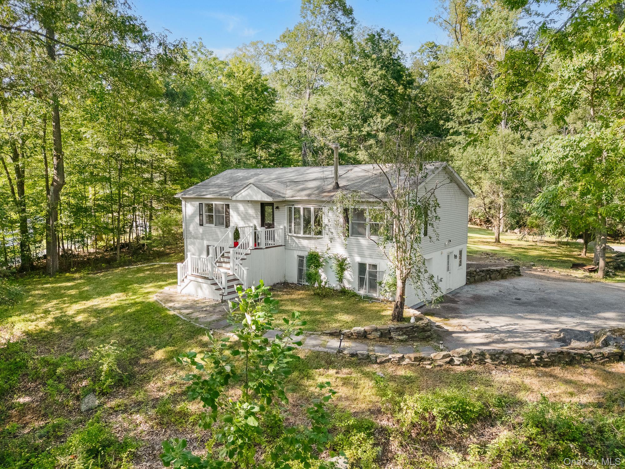 Sitting on a serene 1.81 acres of land within the Croton Harmon School...
