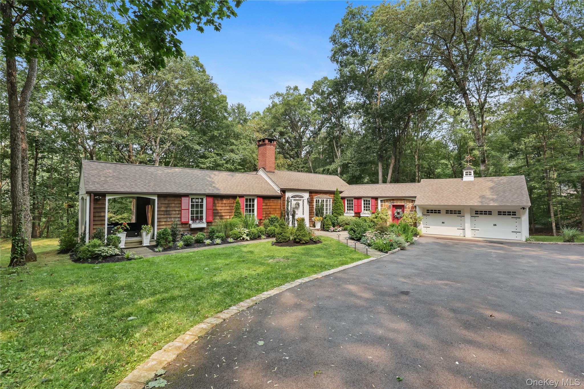 Hywood Ledge is a spectacular expanded ranch in the desirable Deepwood...