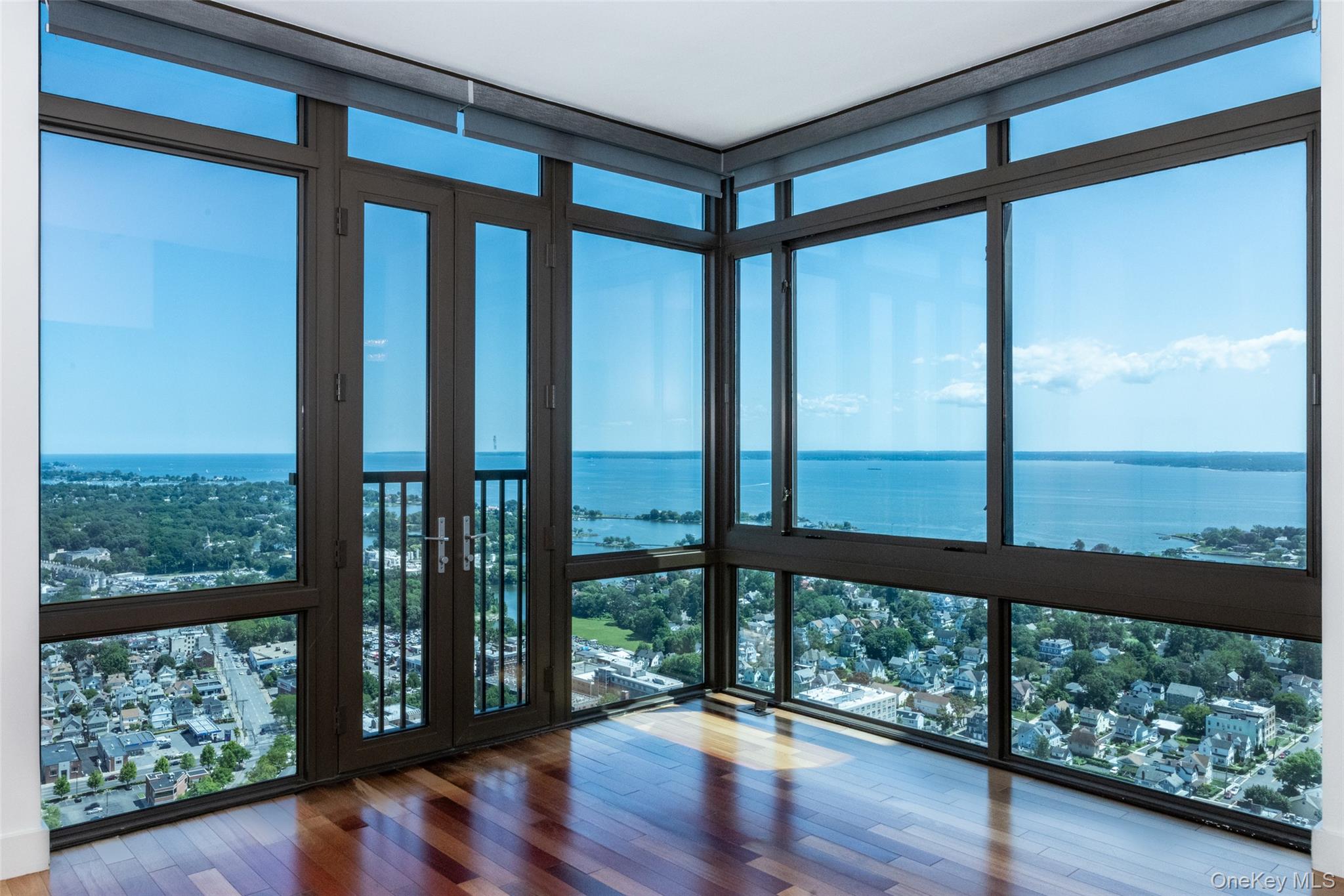 Perched high above the city, this exceptional three-bedroom corner res...