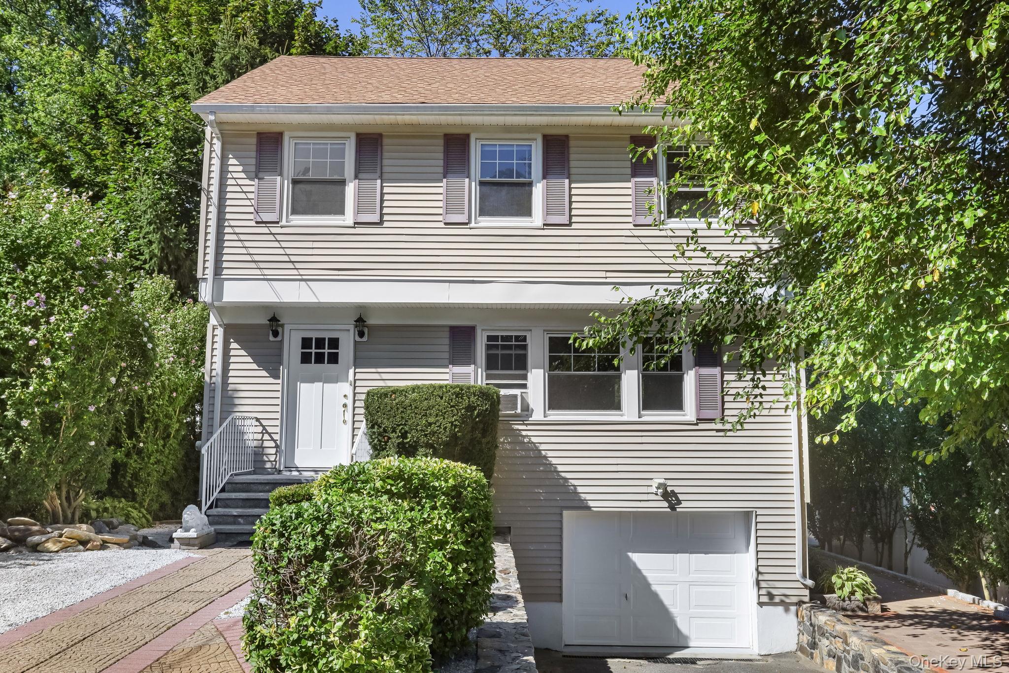 Welcome to this delightful Colonial-style home located on a peaceful r...