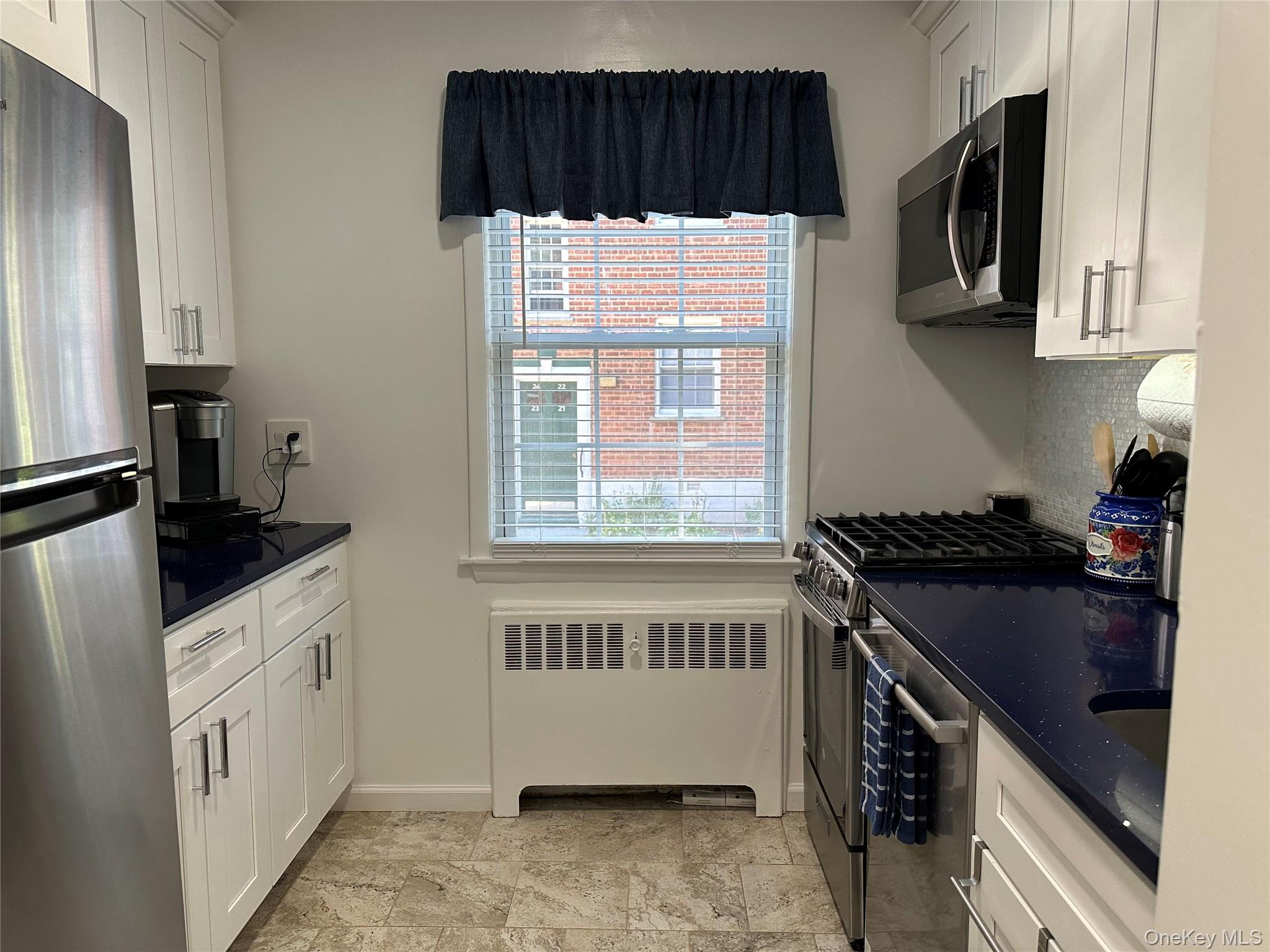 Move right in to this beautifully renovated, fully furnished garden-st...
