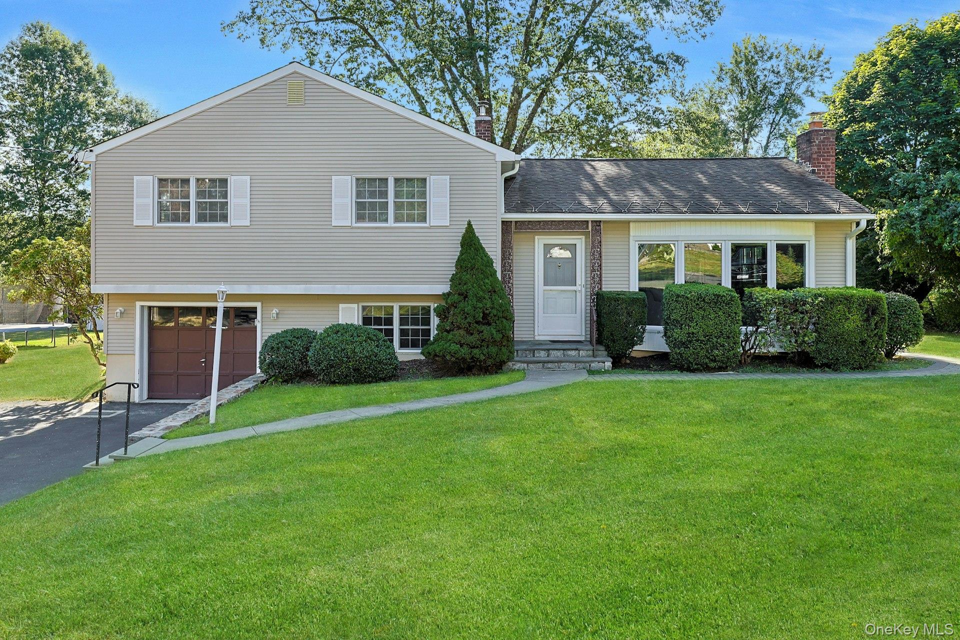 Set back on nearly half an acre of private, level property, this well-...