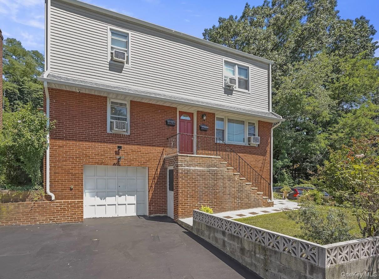 Well maintained brick-front two family home, in ready move-in conditio...