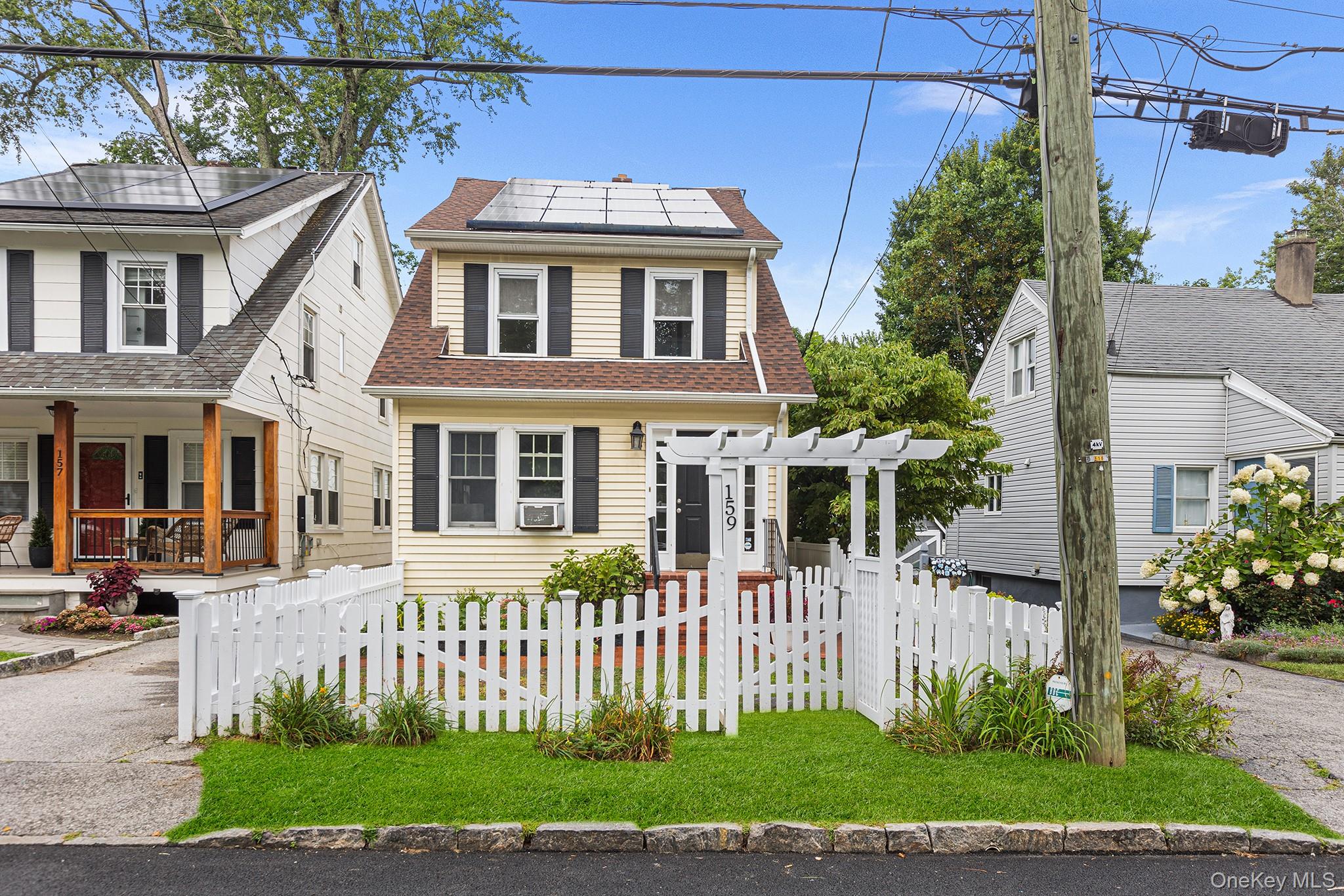 This charming three-story home offers the perfect balance of convenien...
