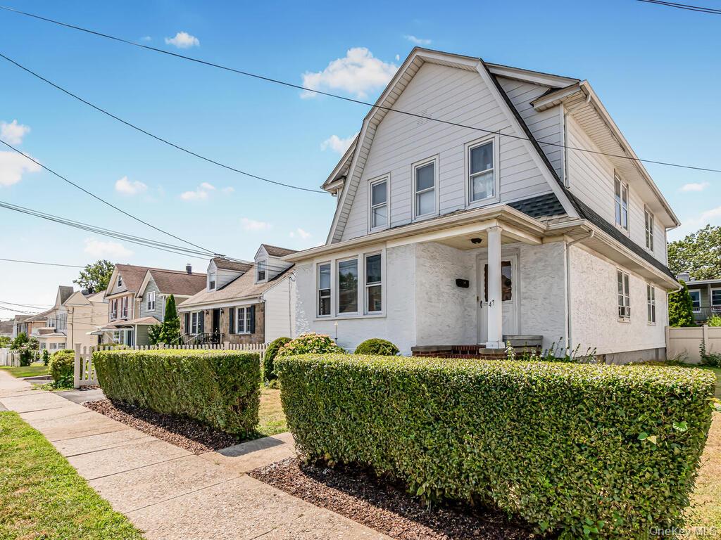 Well Maintained Legal Two Family Stucco home on lovely level property...
