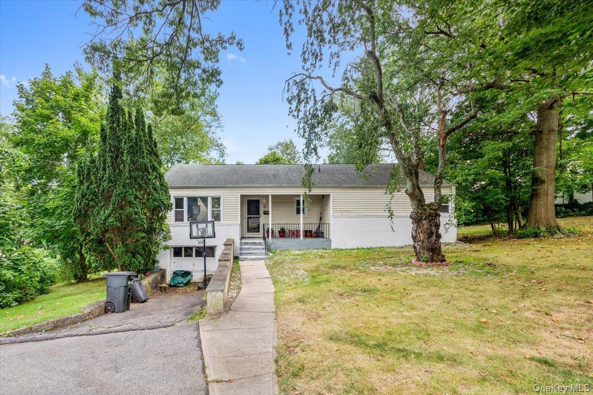 Welcome to 101 Cresthill Road, a charming ranch sitting on a rare, dou...