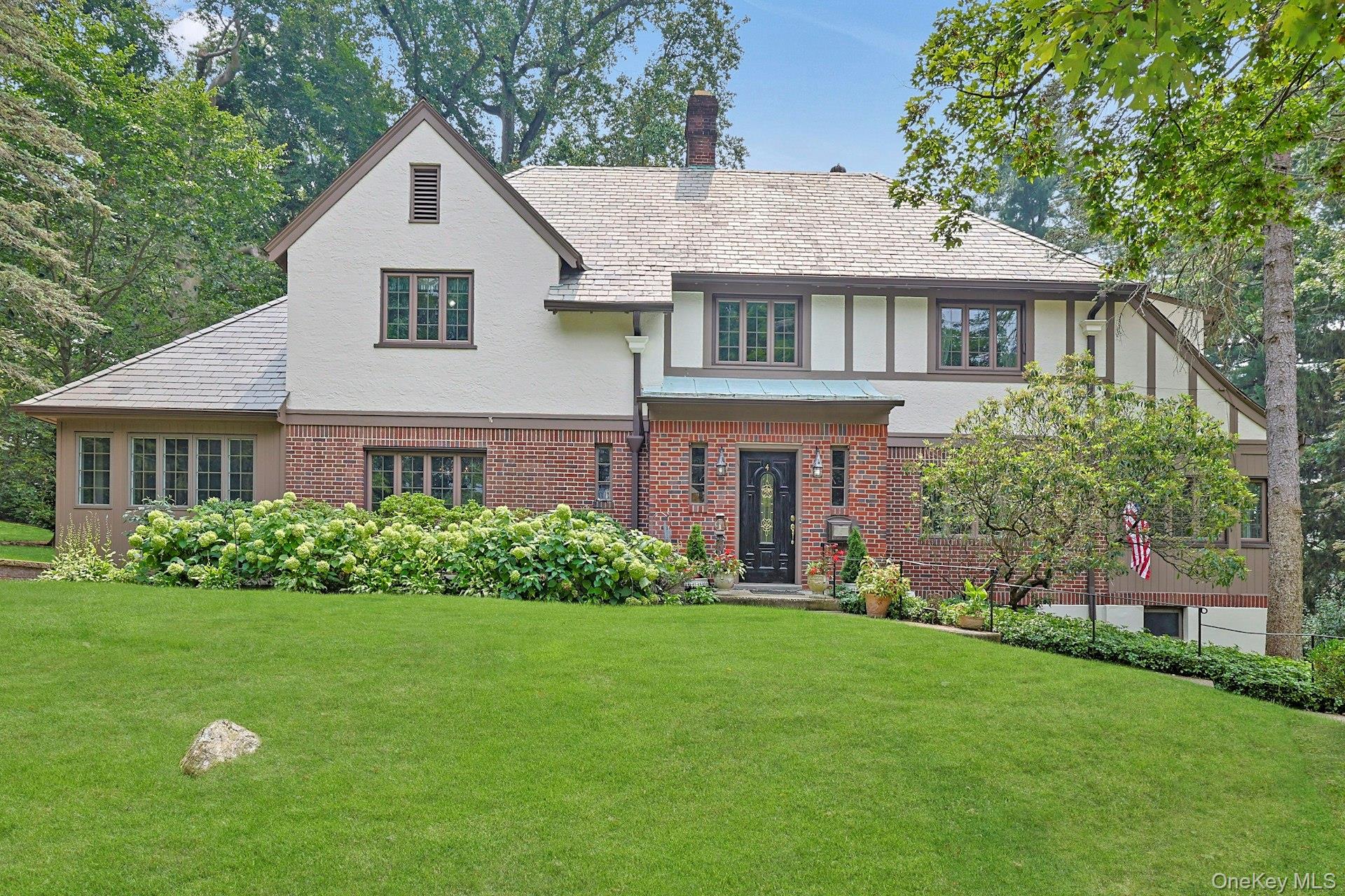 Picture perfect 4 bedroom 3.2 bath Tudor home in sought after Philipse...
