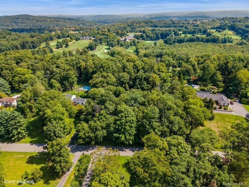 BUILD YOUR CUSTOM HOME ON THIS UNIQUE LOT IN THIS WELL SOUGHT-AFTER CO...
