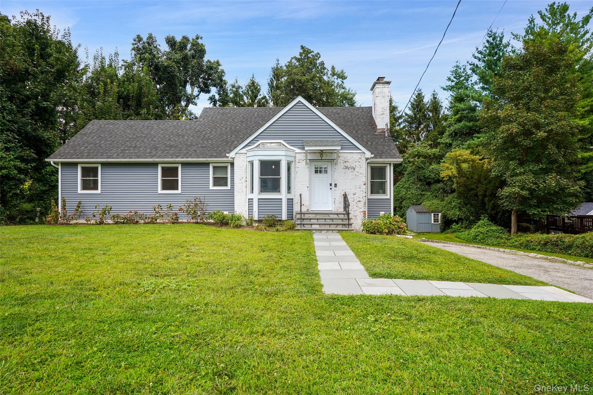 Welcome to this picture-perfect cape set on a quiet street, just minut...