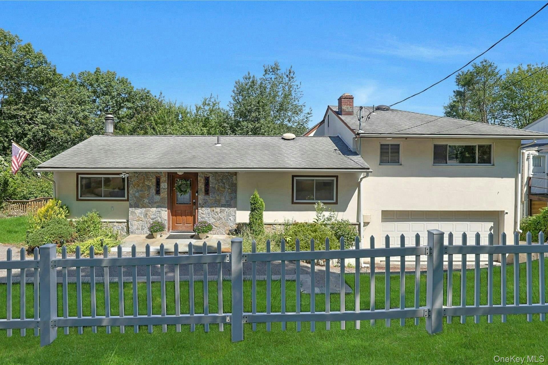Move-in ready four-bedroom, three-bathroom split level home located in...