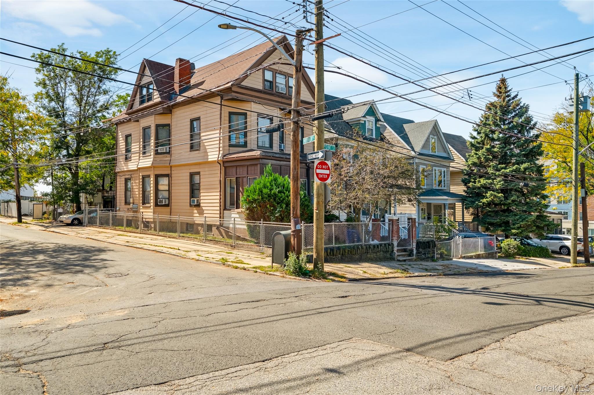 Welcome to 40 Point Street — a fully occupied three-family property pe...