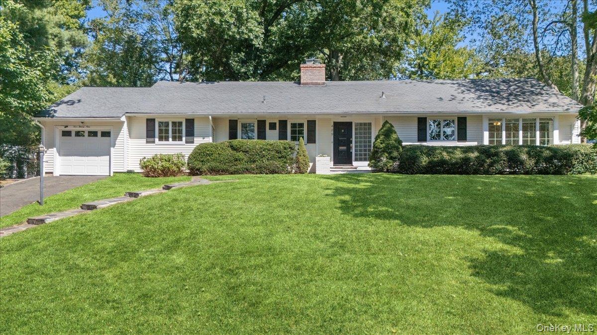 Enjoy easy, one-floor living at its absolute best in this extraordinar...