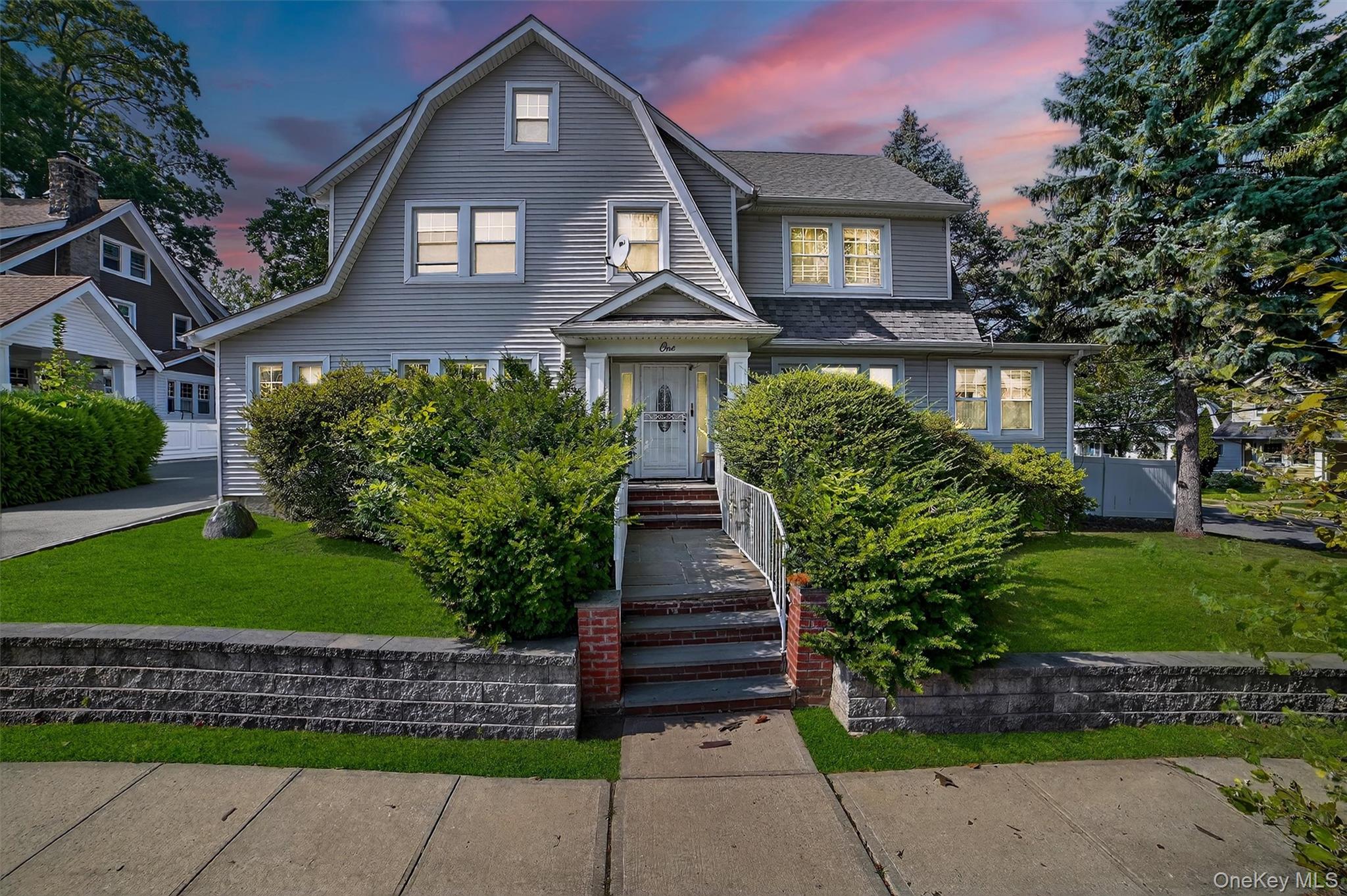 Welcome to 1 Irving Place in New Rochelle, a timeless colonial offerin...