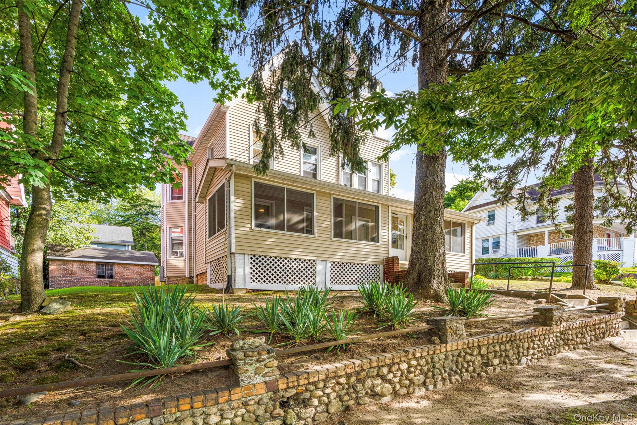 Set back from tree-lined street with attractive curb appeal in the vib...