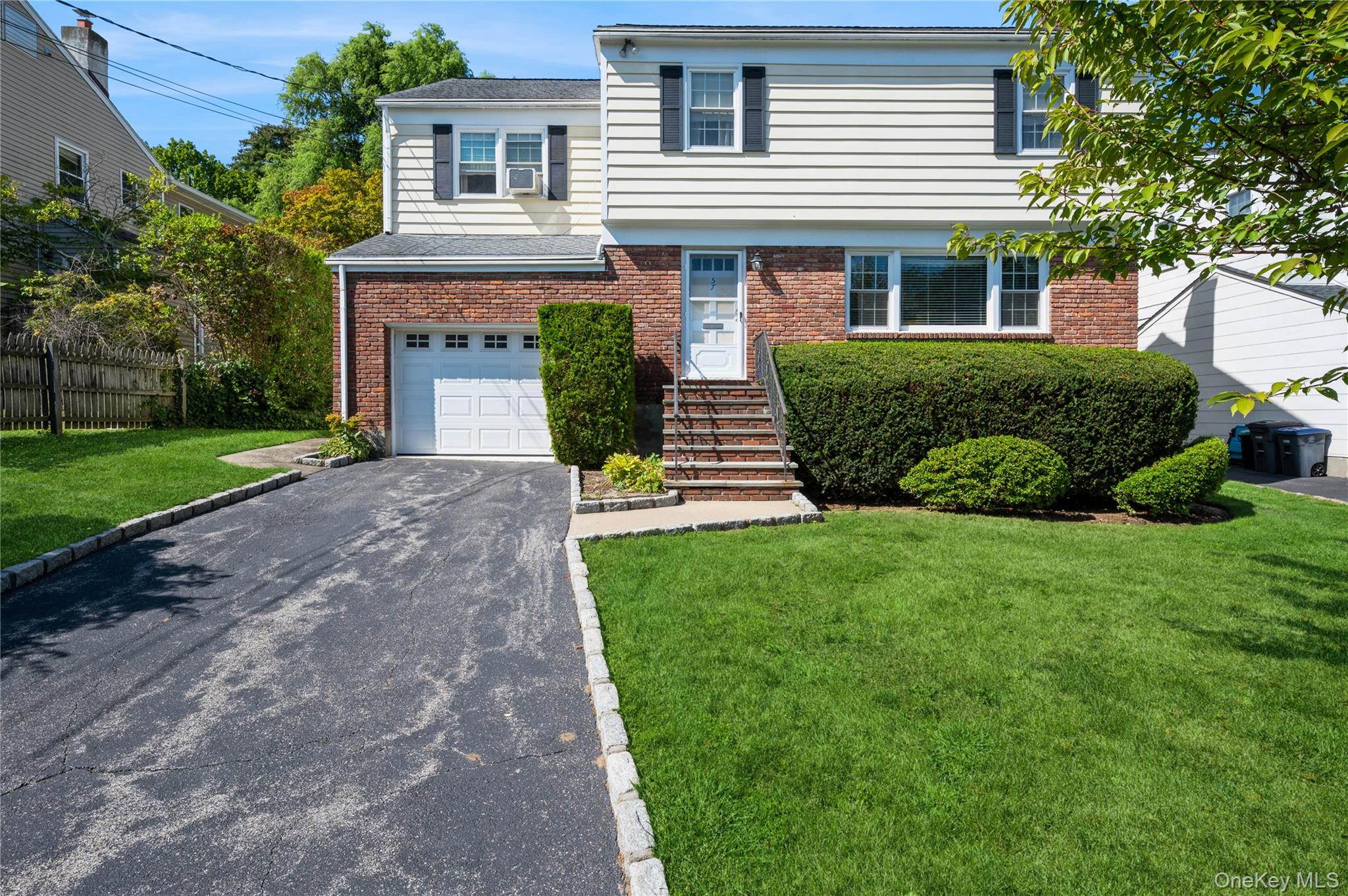 This spacious 4-bedroom side colonial combines classic design with mod...