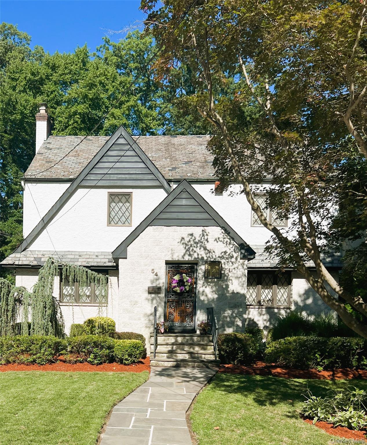 Welcome to pastoral Hunt Woods Preserve! This expansive English Tudor...