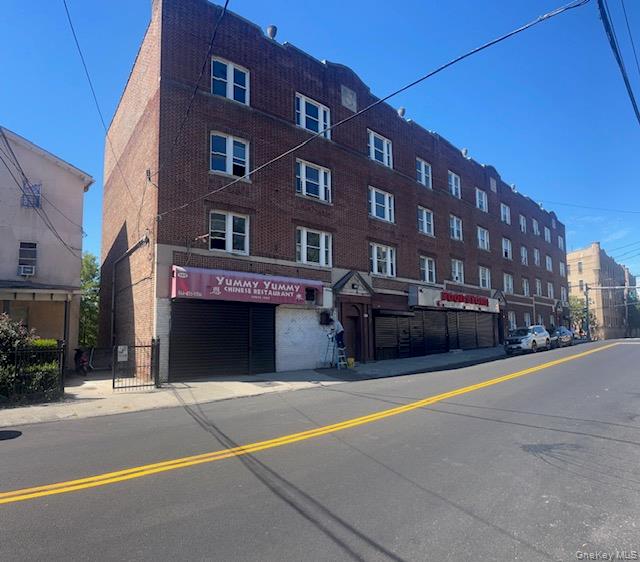 A transit-oriented retail storefront on a busy Yonkers street, just st...
