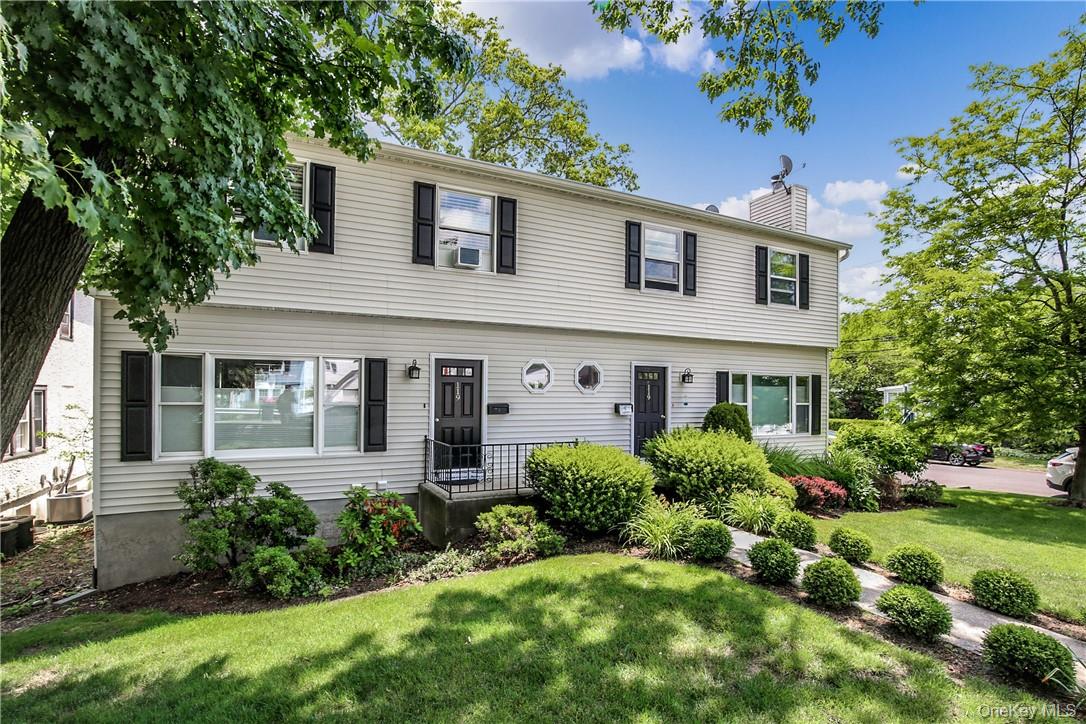 Delightful and spacious townhouse in appealing side-by-side two family...