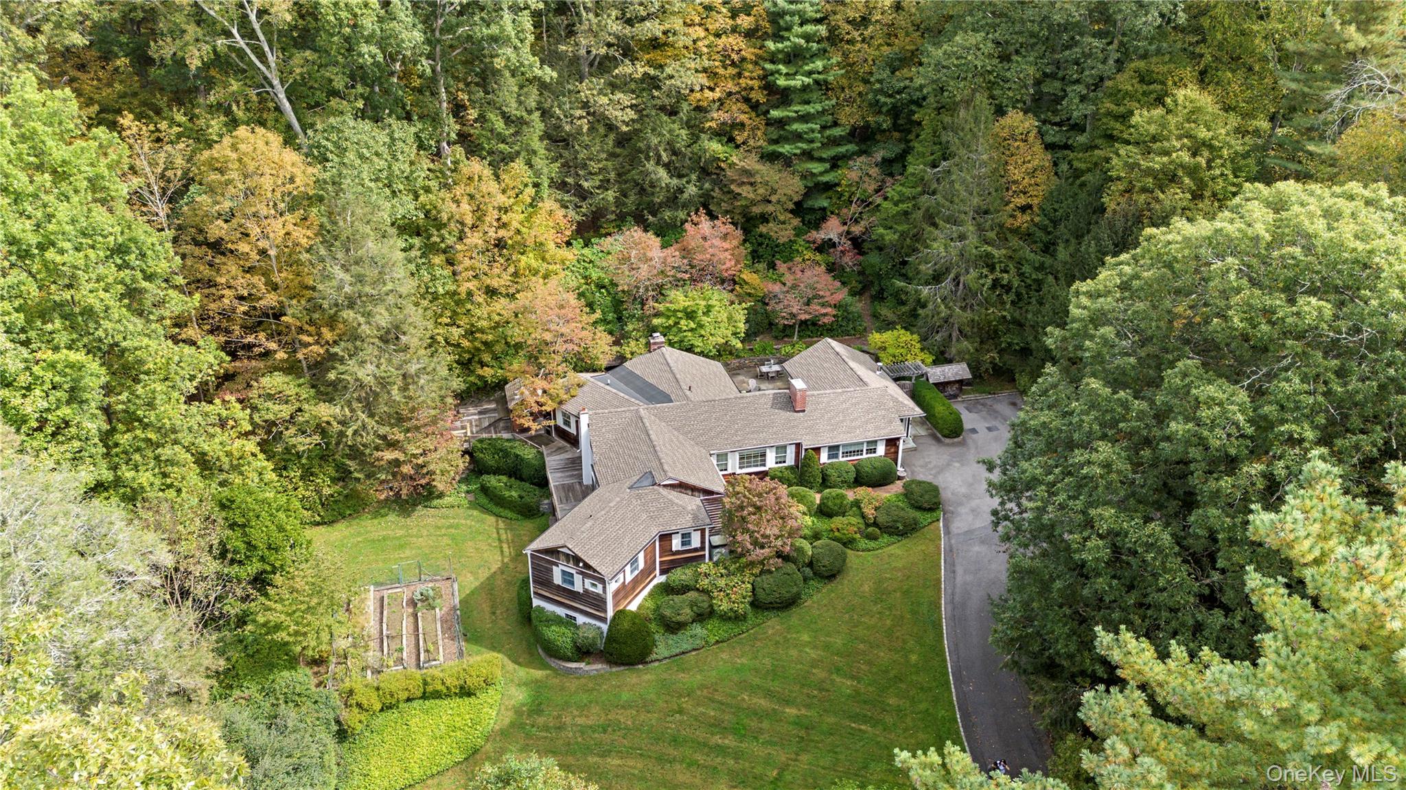 Charming Bedford Retreat with a Storied Past. Set among lush, beautifu...