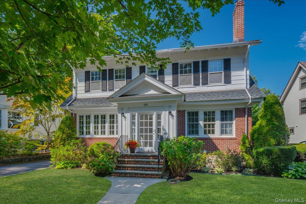 Tucked beneath mature trees on a picturesque block, this move-in-ready...