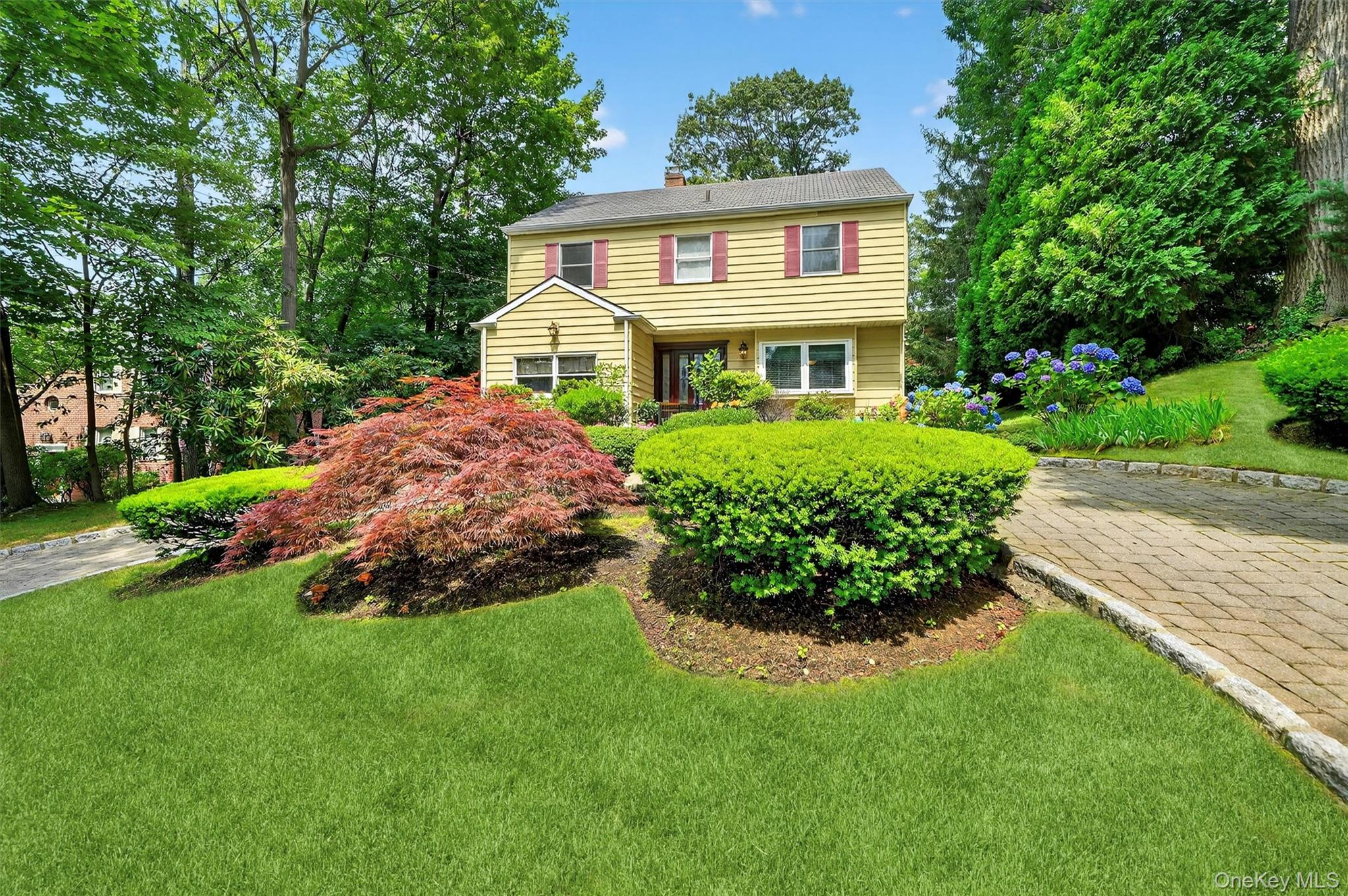 Welcome to 99 Spencer Drive, New Rochelle – a beautifully maintained C...