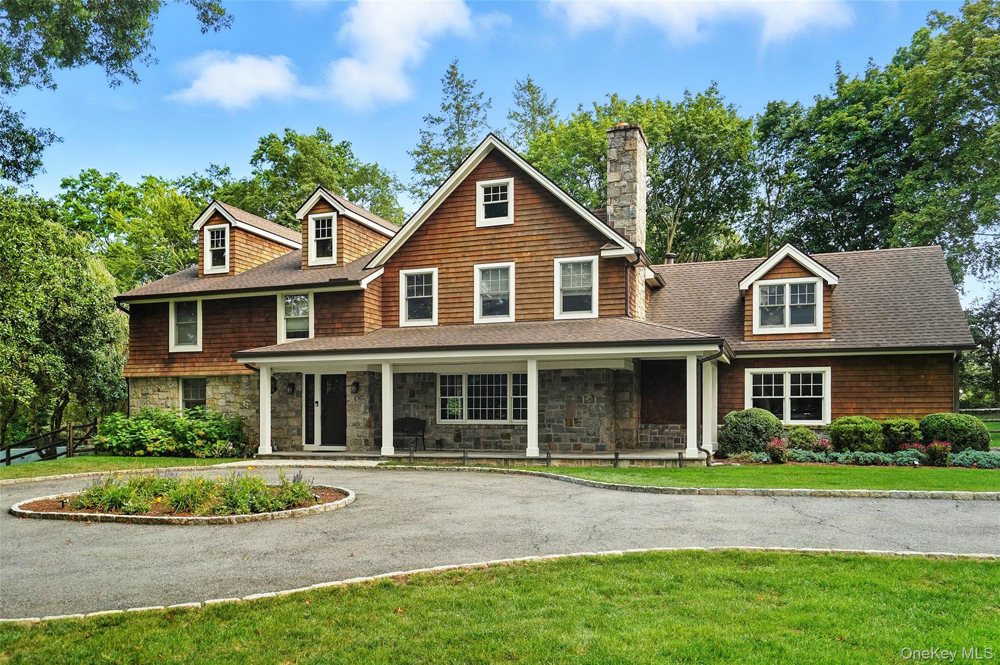 Discover the perfect getaway in this stunning shingle-style home, idea...