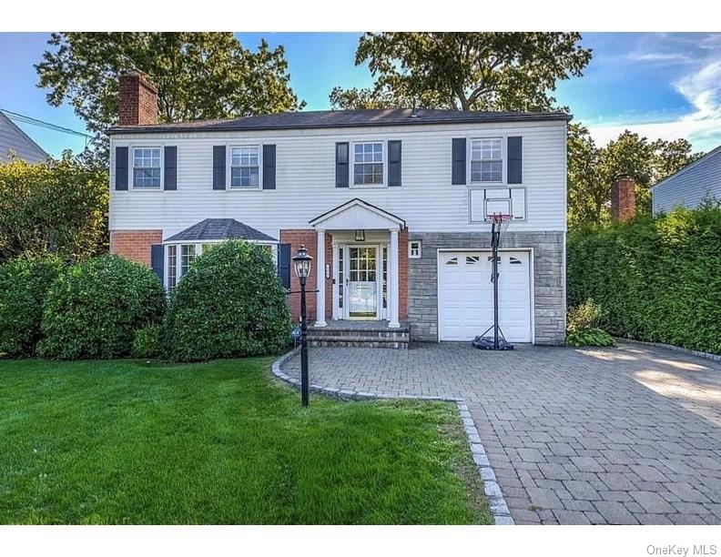 This sun-filled home offers gleaming hardwood floors, a spacious and f...
