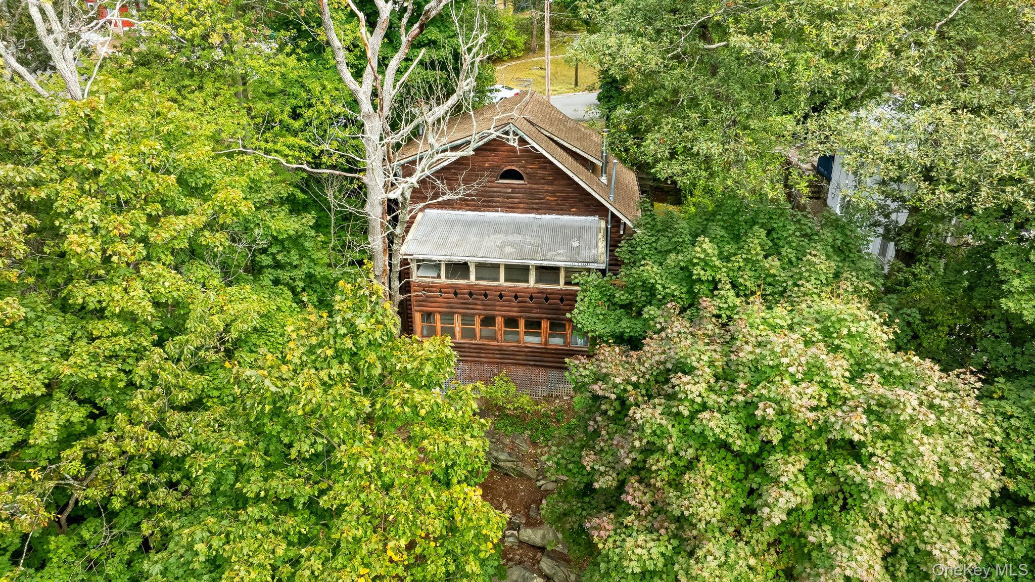 Your peaceful getaway overlooking Lake Mohegan awaits! Stunning season...
